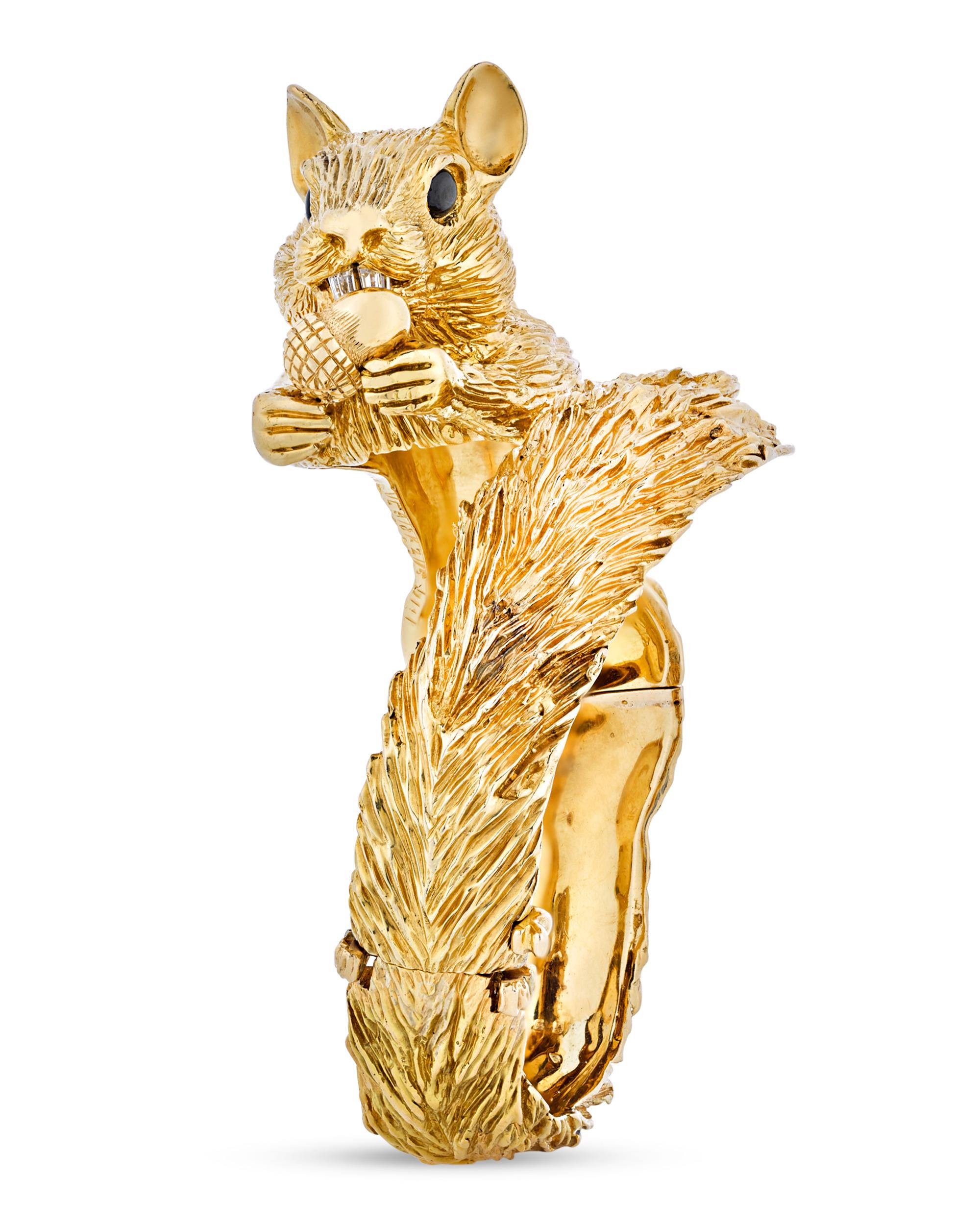 This highly original bracelet by Van Cleef & Arpels represents the famed jewelry house at its most creative. Crafted in the endearing form of a squirrel, the 18K yellow gold bangle is perfectly textured to evoke the coarse fur of the woodland