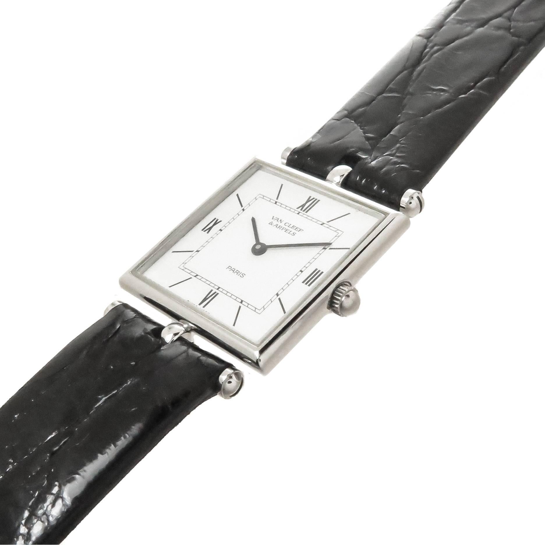 Circa 2000 Van Cleef & Arpels Classique Collection Wrist watch, 25 X 25 MM 2 piece Stainless Steel Case. Quartz Movement, White Dial with Black Roman Numerals. New Black Crocodile Strap with original Van Cleef Steel Buckle. Watch length 8 1/2