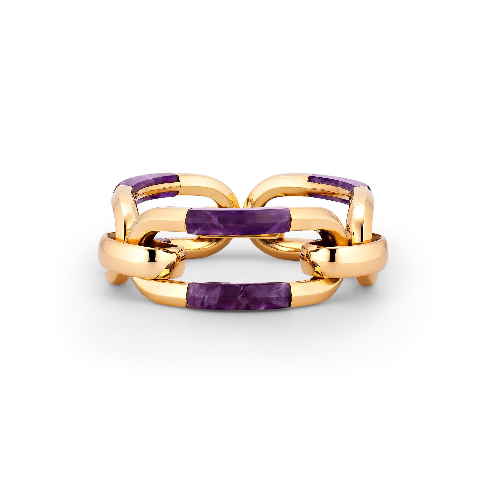 The magnificent purple stone Sugilite is classified as a rare gem. It is thought to generate positive energy protecting against and overcoming negative emotions and situations.  This Van Cleef & Arpels vintage statement bracelet,  with six deep