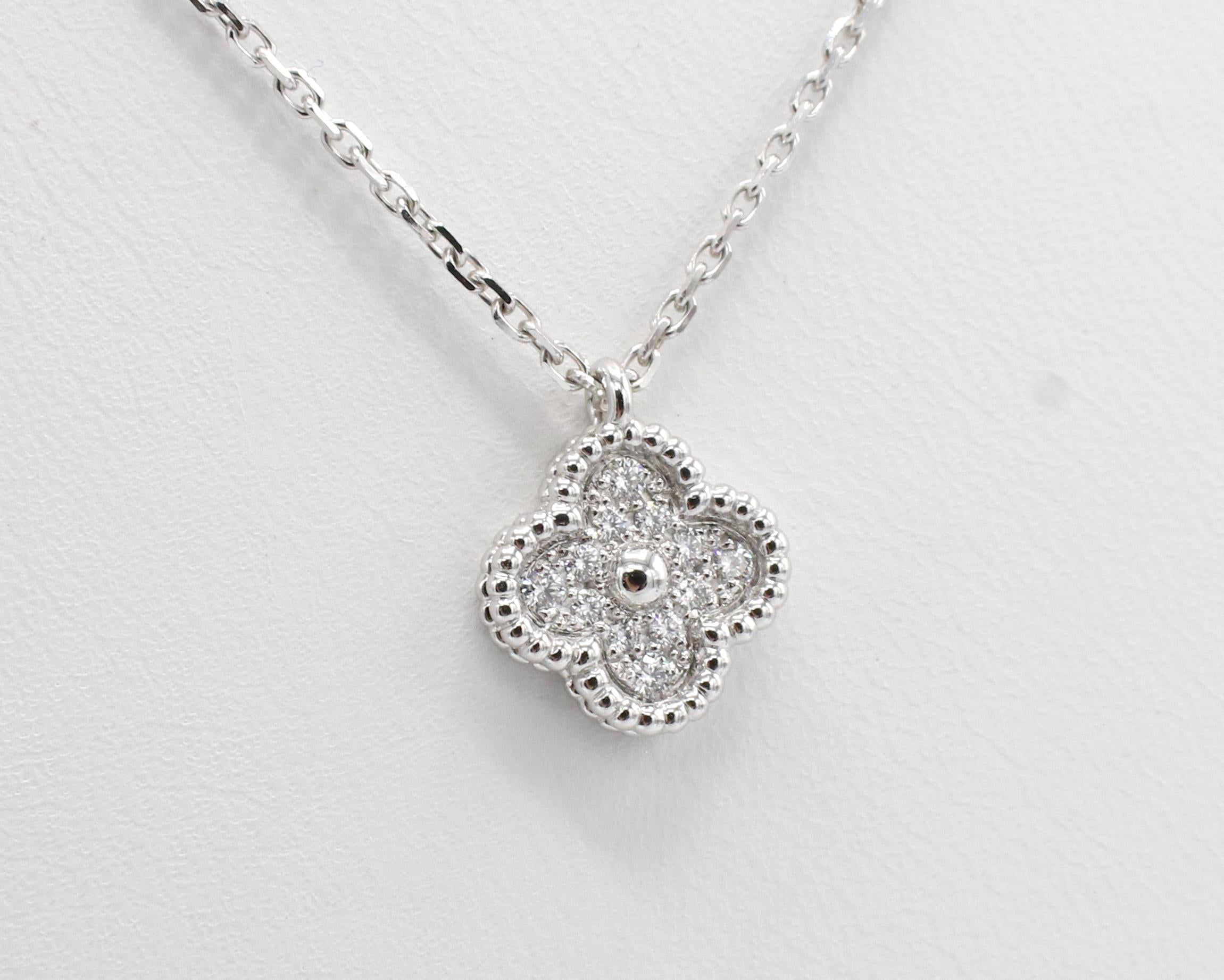 Van Cleef & Arpels Sweet Alhambra 18 Karat White Gold Diamond Pendant Necklace 
Metal: 18k white gold
Weight: 3.33 grams
Diamonds: Approx. .08 CTW E-F VVS round diamonds
Pendant: 9 x 9mm
Chain length: 15.75