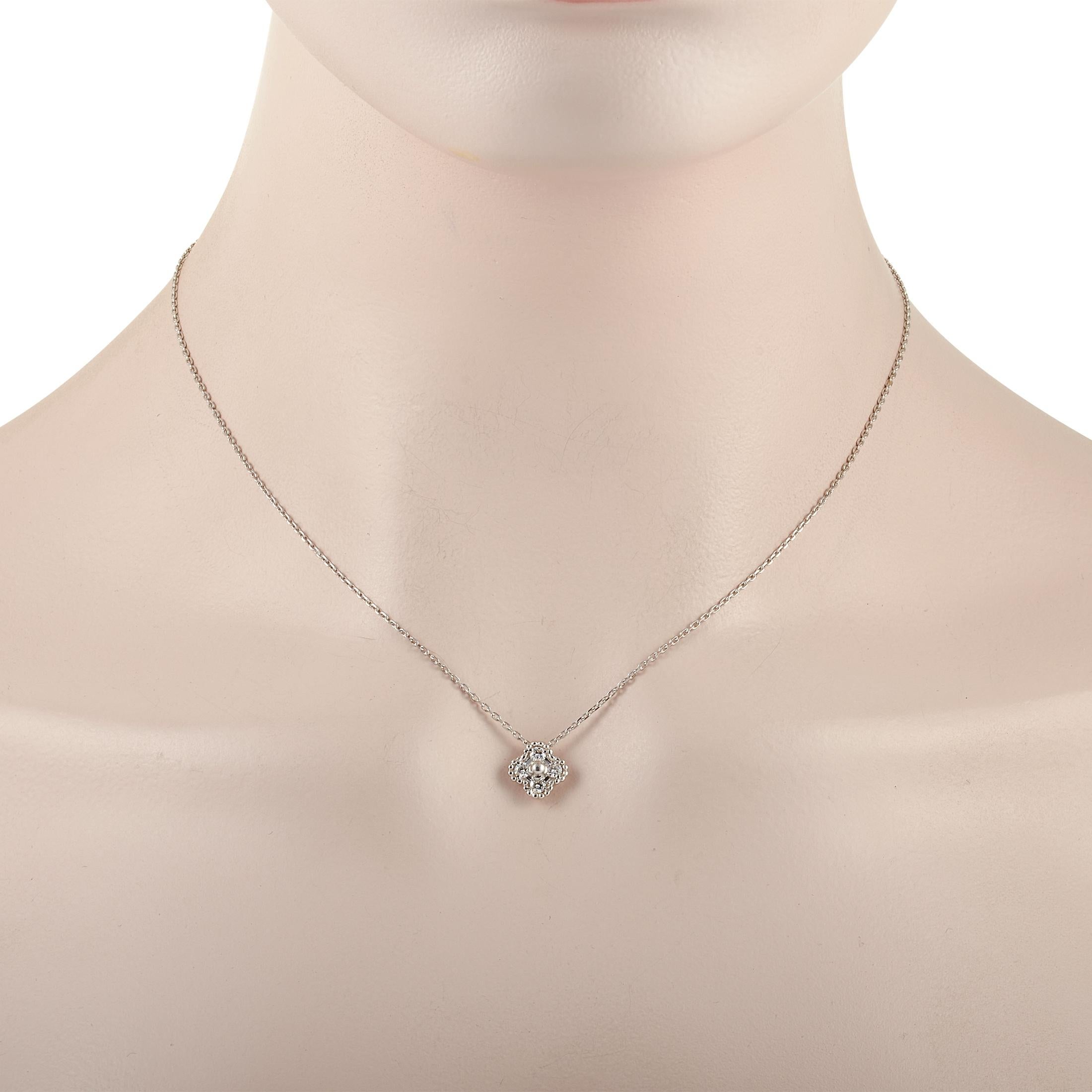 This classic Van Cleef & Arpels Sweet Alhambra 18K White Gold Diamond Necklace is made with an 18K white gold chain that highlights a white gold Alhambra pendant set with four round diamonds. The dainty chain measures 16 inches in length and