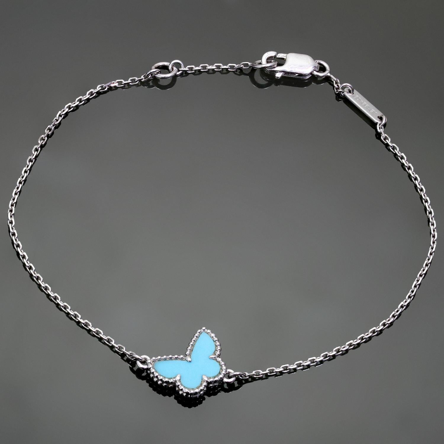 This stunning Van Cleef & Arpels bracelet from the iconic Sweet Alhambra collection feature the classic butterfly accent crafted in 18k white gold and set with blue turquoise. Made in France circa 2000s. Measurements: 0.38