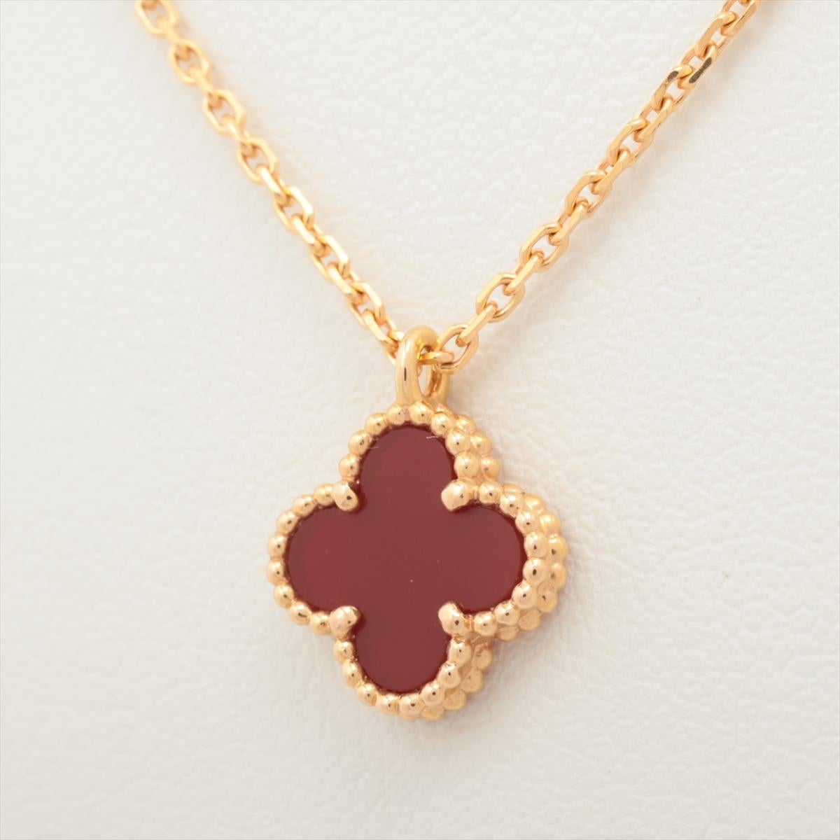 The Van Cleef & Arpels Sweet Alhambra Carnelian Necklace in Gold is a stunning piece of jewelry that exudes elegance and sophistication. Crafted by the renowned luxury brand Van Cleef & Arpels, the necklace features a delicate pendant in the shape