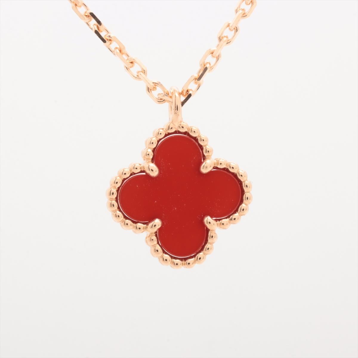 The Van Cleef & Arpels Sweet Alhambra Carnelian Necklace in Gold is a stunning piece of jewelry that exudes elegance and sophistication. Crafted by the renowned luxury brand Van Cleef & Arpels, the necklace features a delicate pendant in the shape
