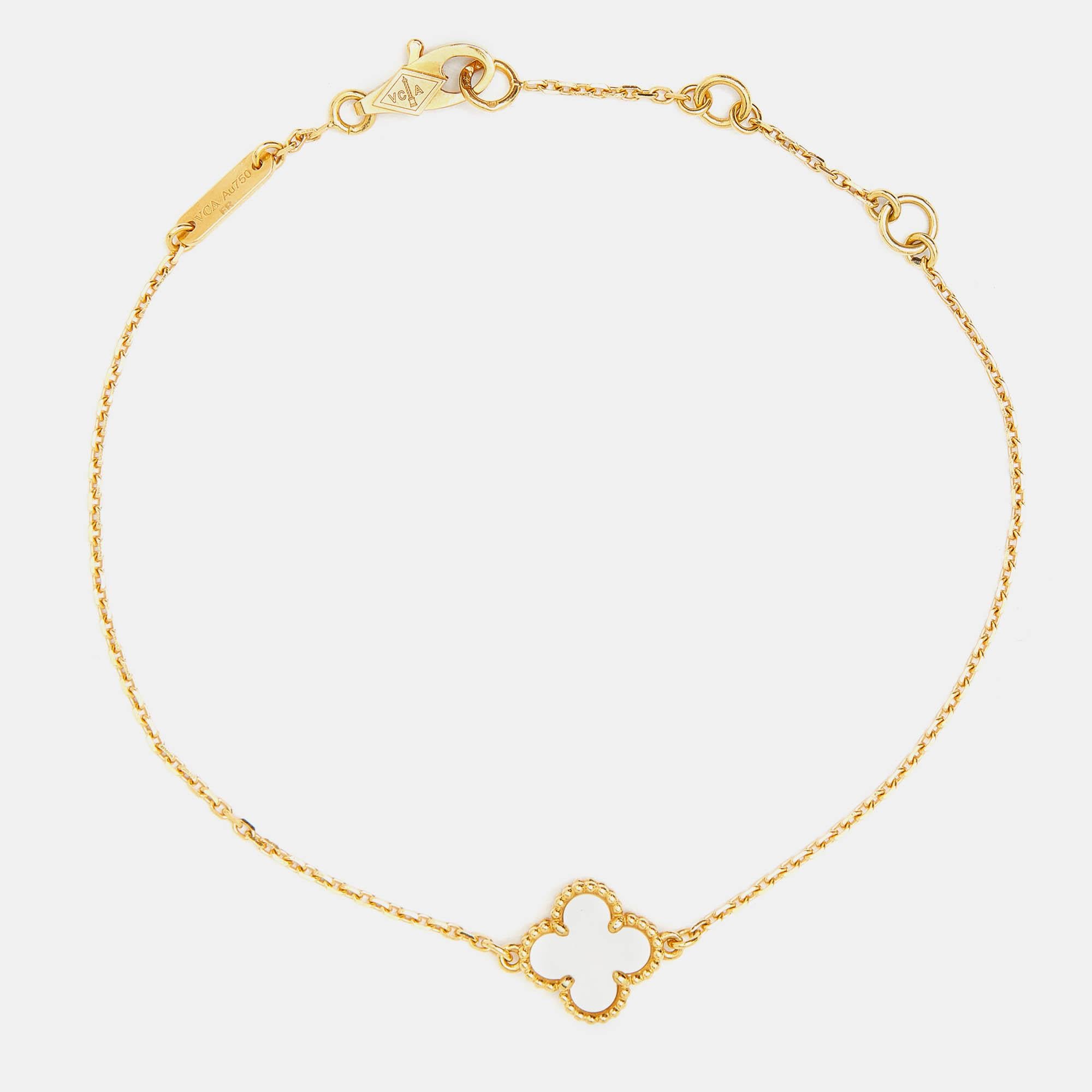 Invest in this opulent Van Cleef & Arpels bracelet from their iconic Sweet Alhambra collection. The 18k yellow gold Alhambra pendant is set with a mother of pearl and held by a chain. A sweet mix of minimalist style and timeless elegance sums up