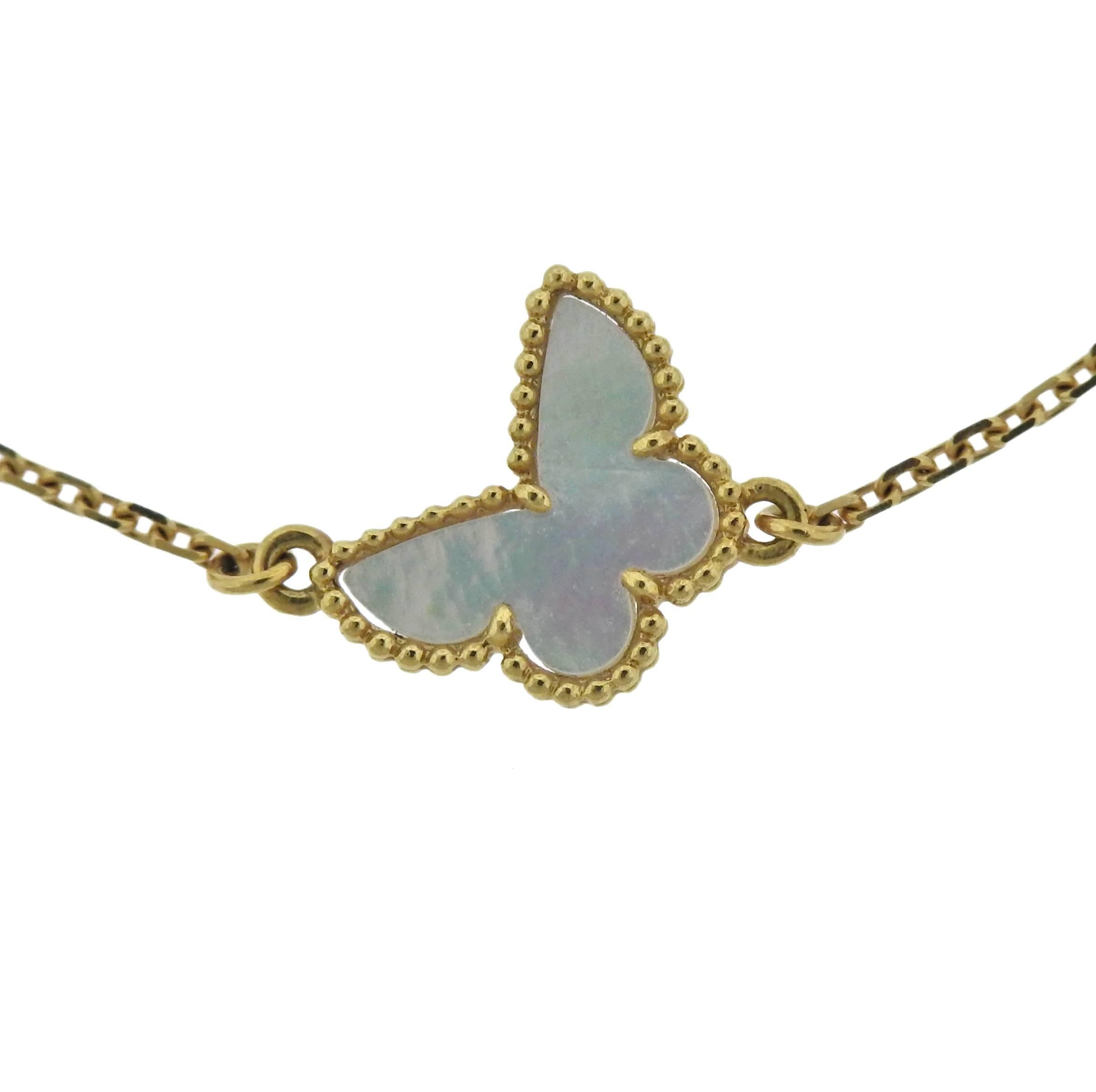18k yellow gold bracelet, crafted by Van Cleef & Arpels for Sweet Alhambra collection, featuring delicate mother of pearl set butterfly motif. Comes with pouch and COA. Retail $1300. Bracelet is 7