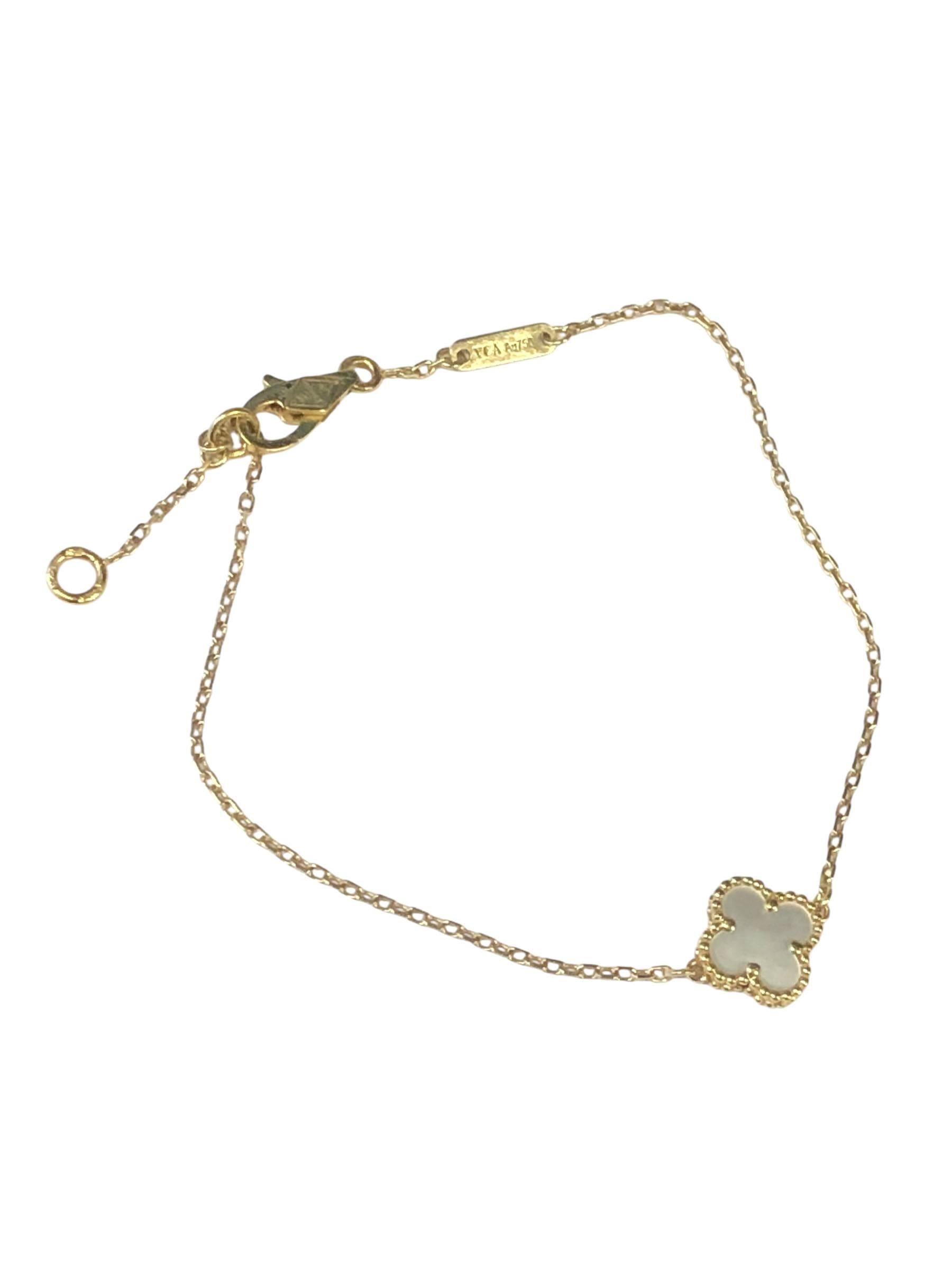 Van Cleef & Arpels Sweet Alhambra collection 18k Yellow Gold Bracelet, measuring 7 inches in length with a White Mother of Pearl set dingle Motif center measuring 5/16 inch in diameter. Comes in original VCA Suede case. 
