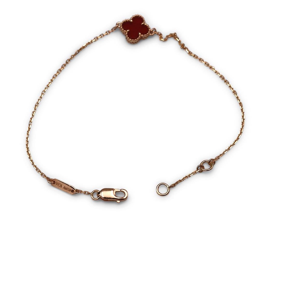 Authentic Van Cleef & Arpels 'Sweet Alhambra' bracelet crafted in 18 karat rose gold features a single carnelian clover motif. The delicate adjustable bracelet measures 7 inches in length. Signed VCA, AU750, with serial number. The bracelet is