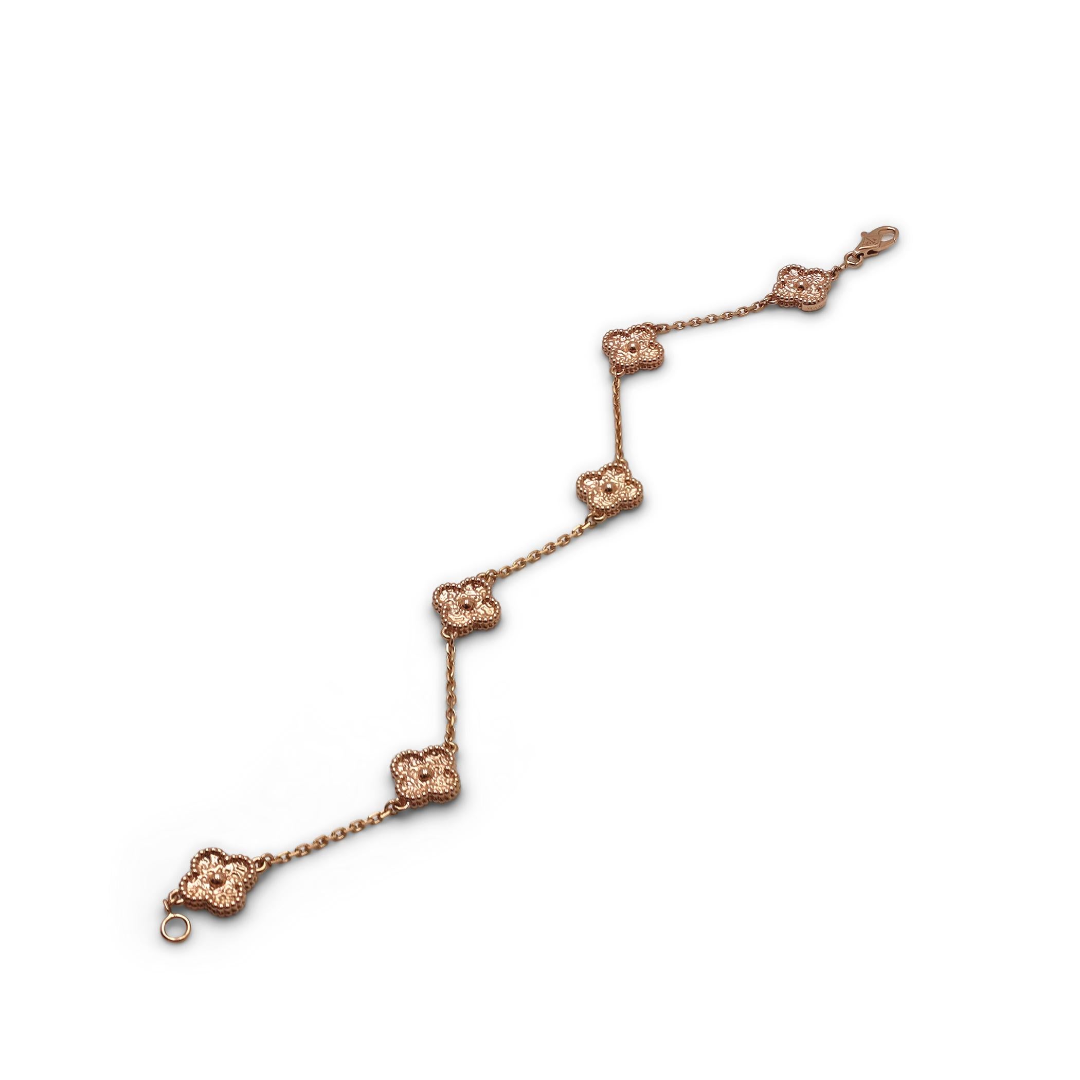 Authentic Van Cleef & Arpels 'Sweet Alhambra bracelet. Featuring 6 motifs crafted in textured 18 karat rose gold. The bracelet measures 7 inches in length. Signed VCA, Au750, with serial number. Bracelet is presented with the original VCA papers, no