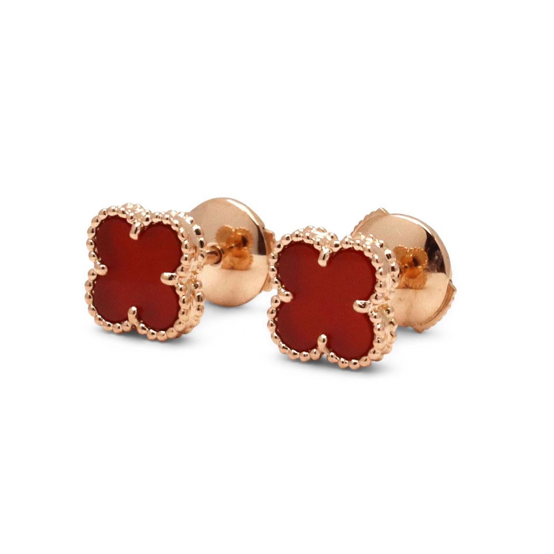 Authentic Van Cleef & Arpels Sweet Alhambra carnelian earrings crafted in 18 karat rose gold. These stunning studs feature the classic 'lucky motif' in miniature form, encasing a carnelian stone. Signed VCA, AU750, with serial number and French