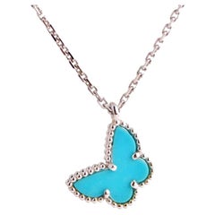 Van Cleef & Arpels Pendentif Sweet Alhambra en or blanc avec papillons et turquoise