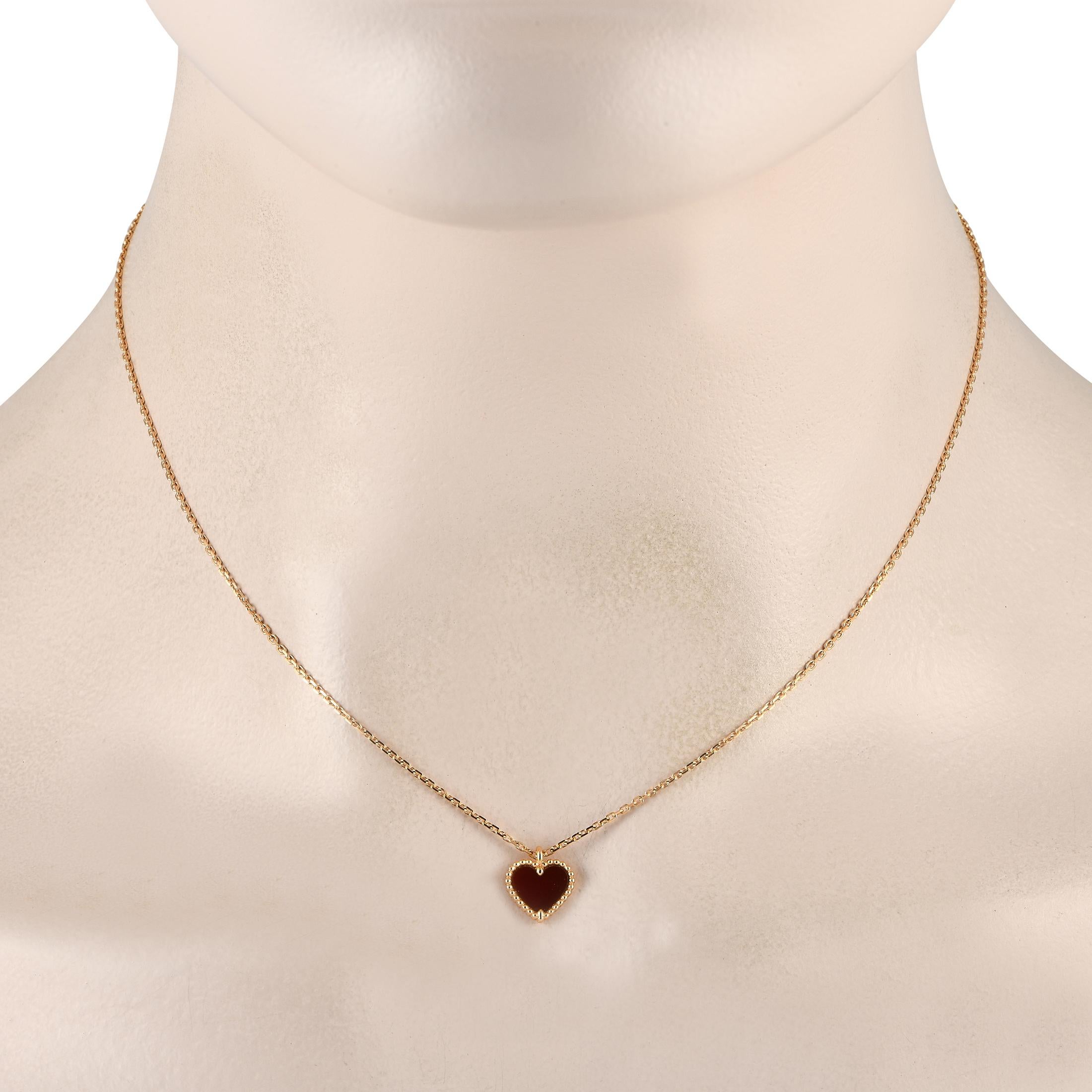 This Van Cleef & Arpels Sweet Hearts necklace is endlessly charming. Suspended from a 16 chain, a heart-shaped pendant measuring 0.25 long by 0.35 wide comes to life thanks to opulent 18K yellow gold metalwork and a vibrant carnelian stone.This