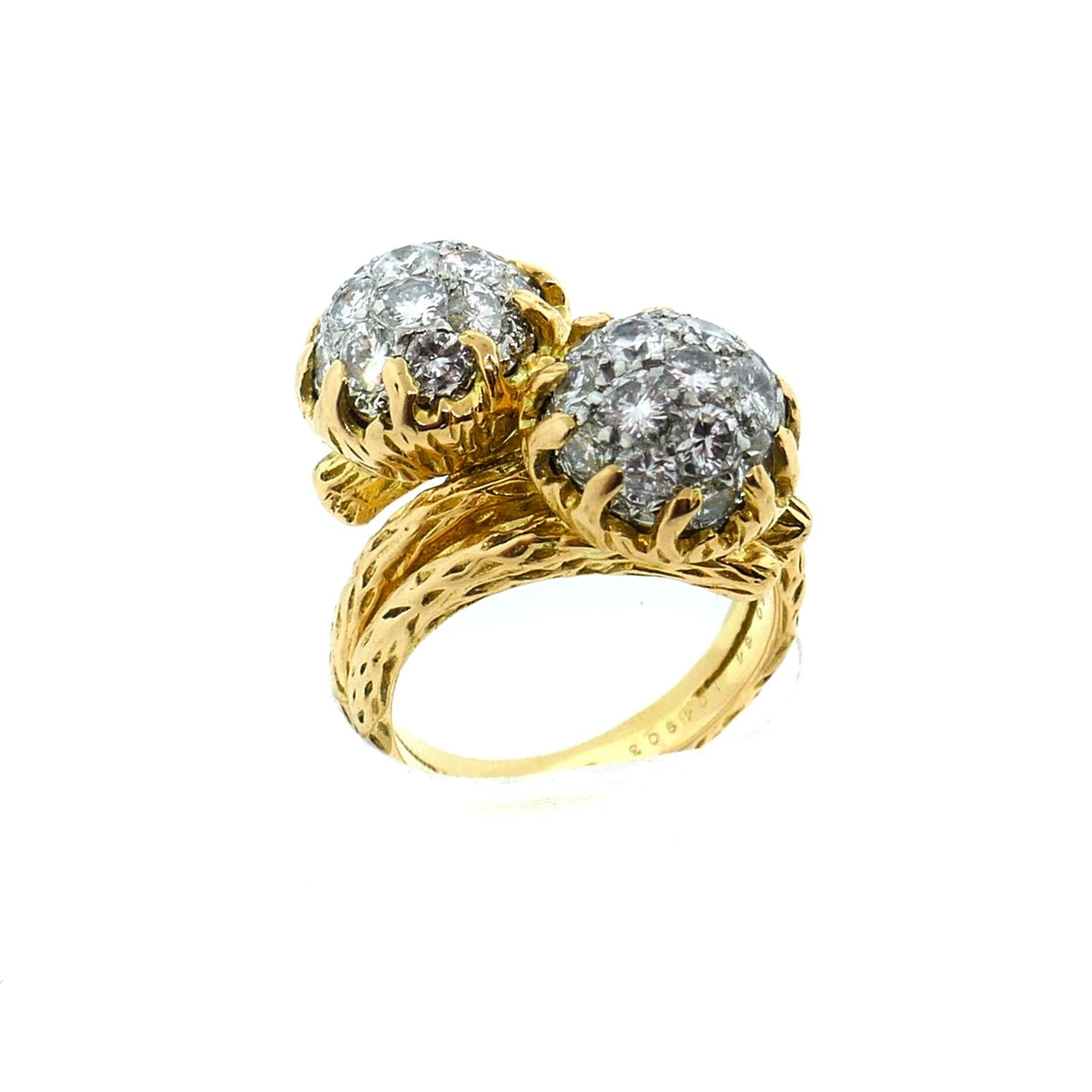 Van Cleef & Arpels Textured 18K Yellow Gold and Platinum Diamond Bypass Ring

This Van Cleef & Arpels ring is done in the classic 
