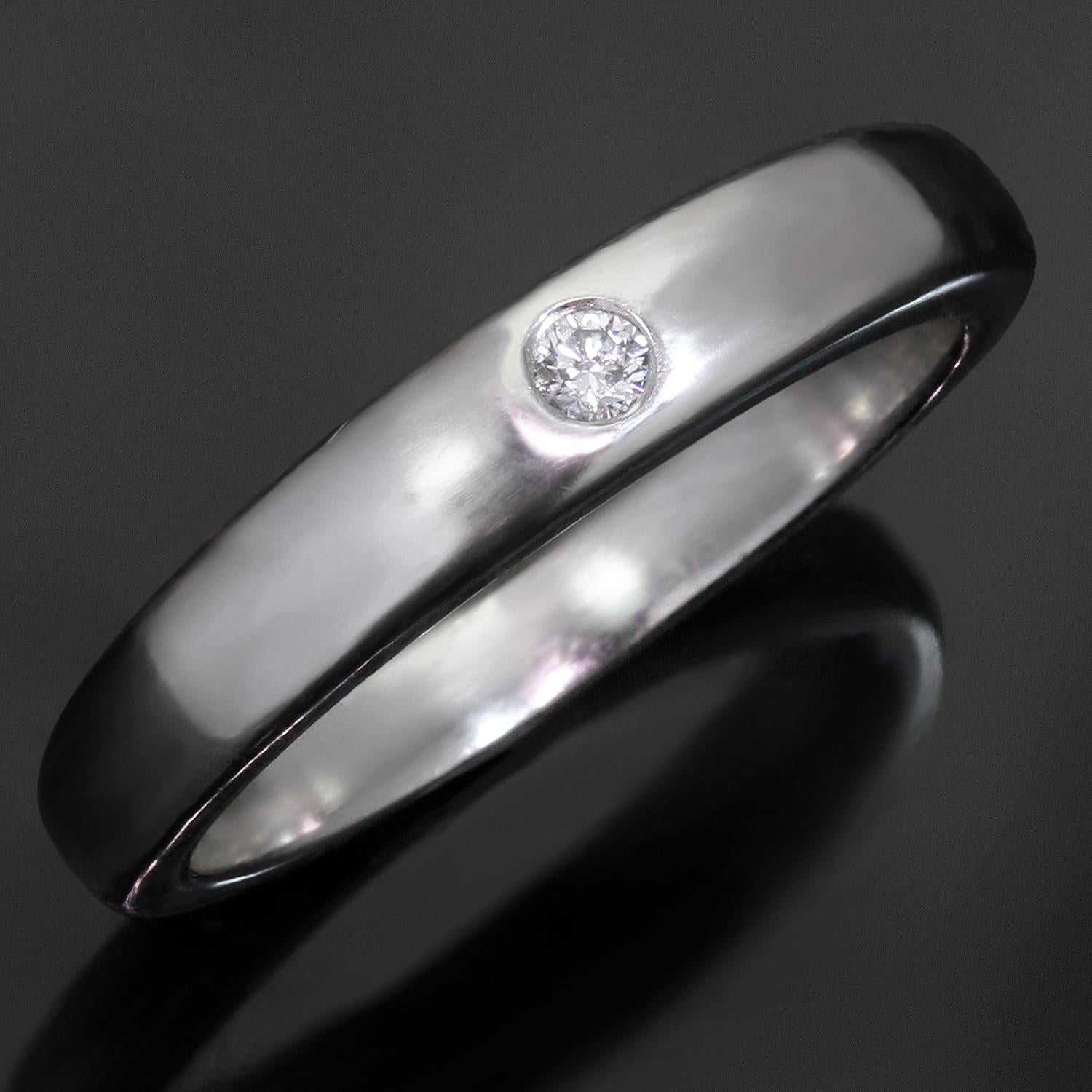 This fabulous Van Cleef & Arpels wedding band from the chic New York collection is crafted in polished platinum and accented with a solitaire round brilliant-cut E-F VVS1-VVS2 diamond weighing an estimated 5.0 carats. The Maison’s calligraphy