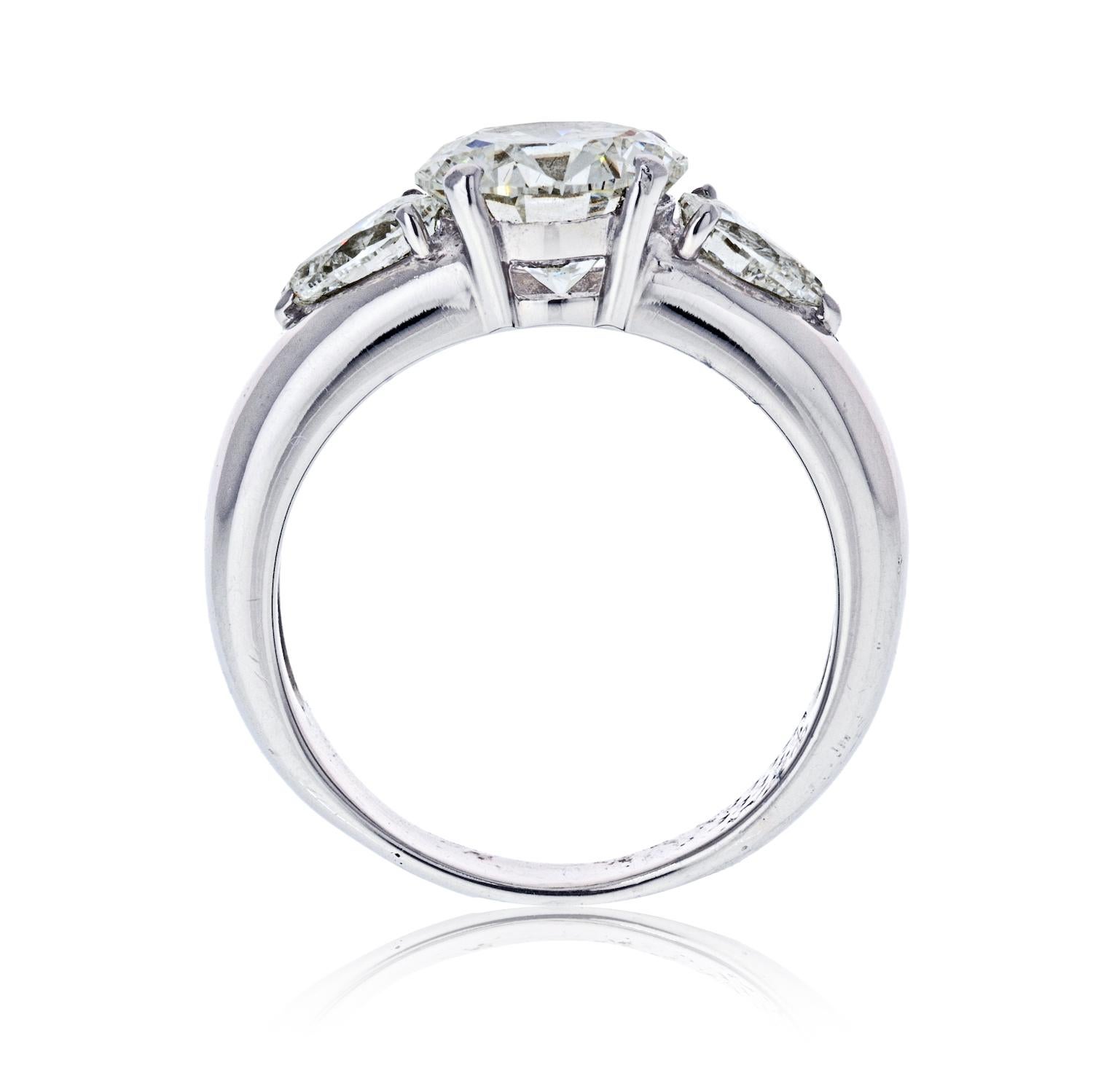 VCA Round Cut Diamond Engagement Ring in Platinum. This modern Van Cleef and Arpels engagement ring features a 2.03 carat round cut diamond. The center diamond is of impeccable quality F color, Flawless clarity with GIA certificate and it really