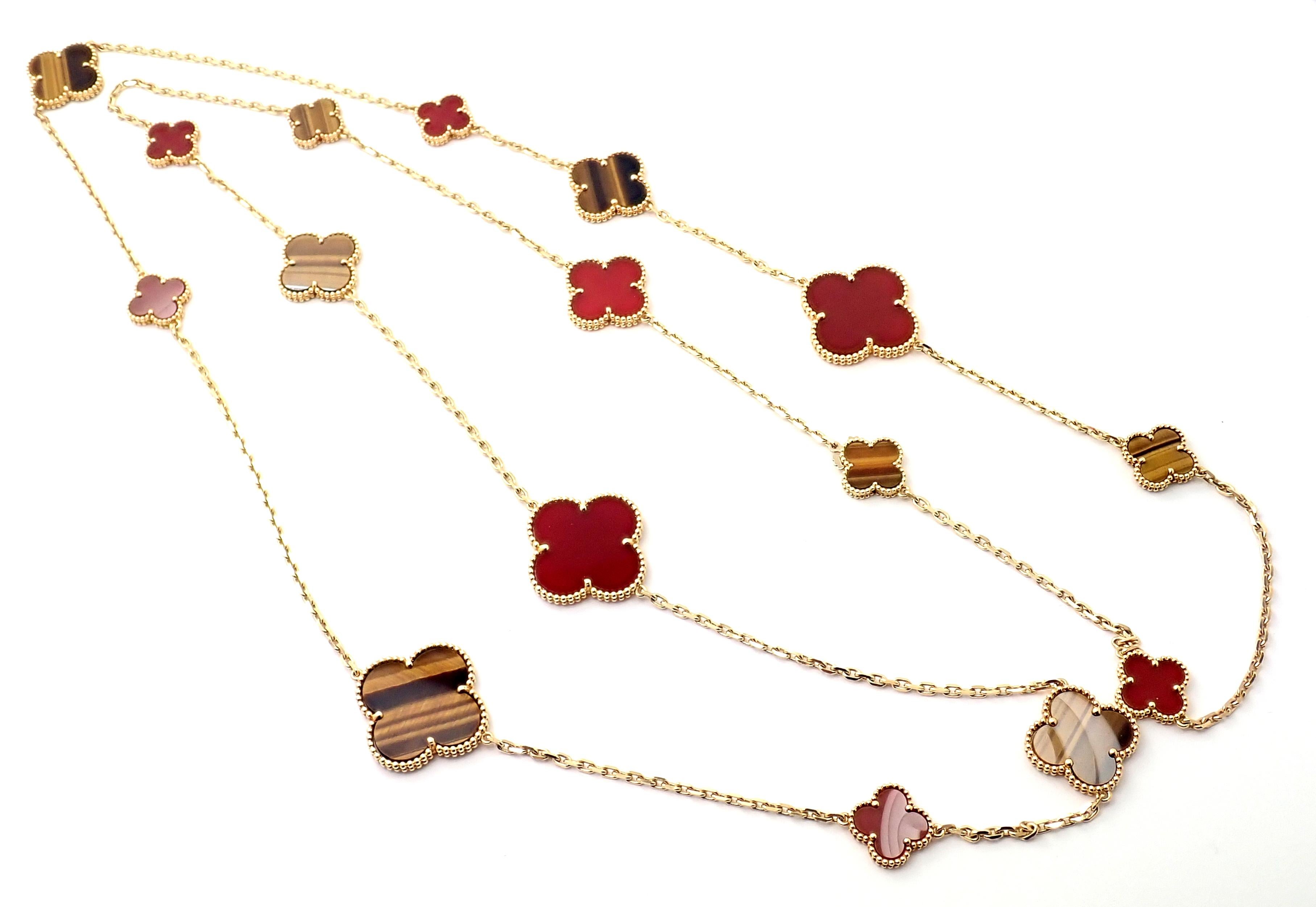 18k Yellow Gold Magic Alhambra sixteen motif necklace with carnelian and tiger's eye by Van Cleef Arpels. Numbered and signed by Van Cleef & Arpels. The Magic Alhambra collection introduces Van Cleef & Arpels' iconic motif in a variation of sizes,