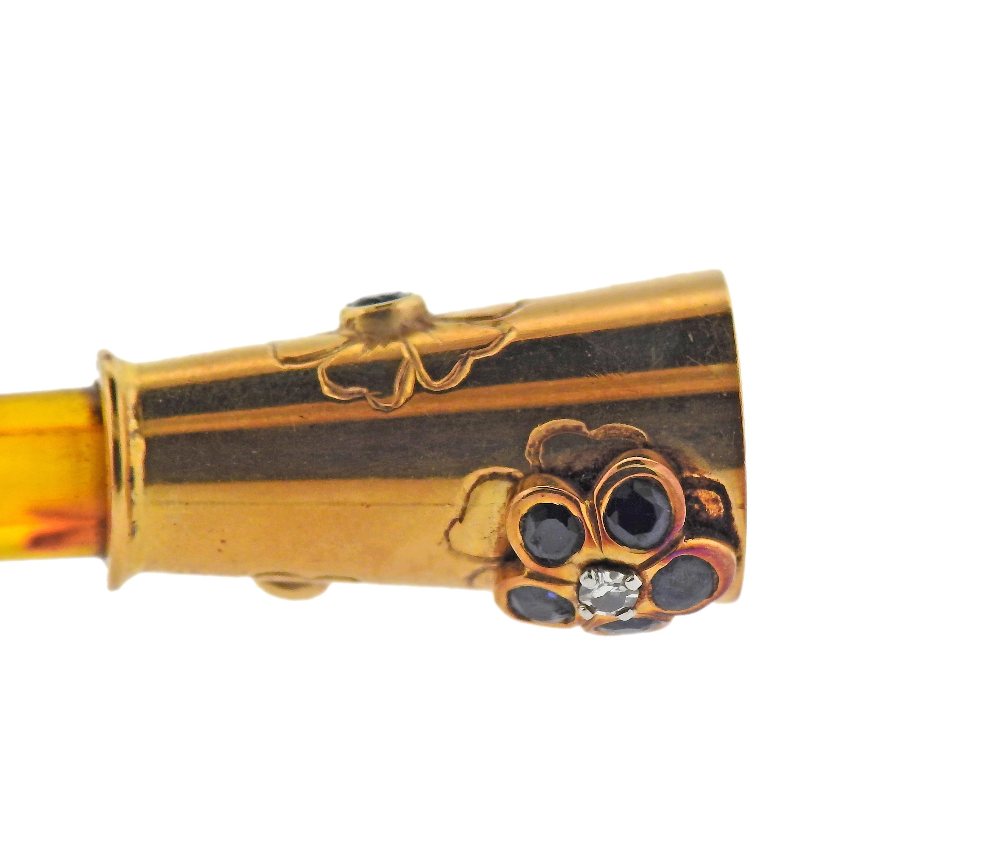 Vintage 18k gold Van Cleef & Arpels cigarette holder, decorated with tortoise and blue sapphires. Measures 3.5