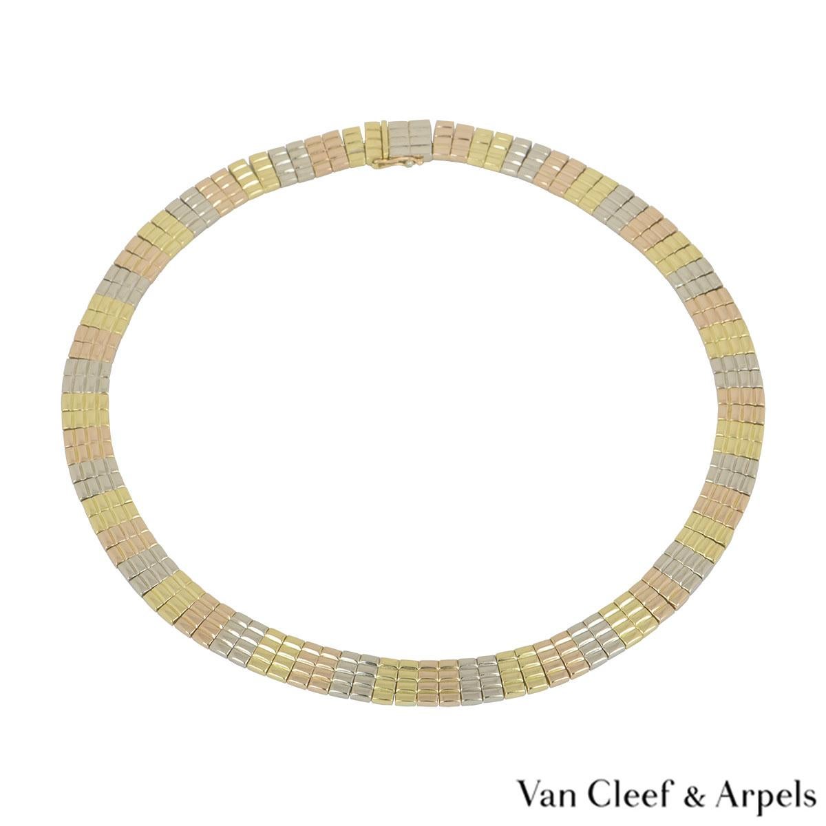 A stunning 18k tri-colour gold necklace by Van Cleef & Arpels. The necklace comprises of a 4 row brickwork design alternating in yellow, white and rose gold. The necklace measures 16.00 inches in length and features a box clasp with a push clasp on