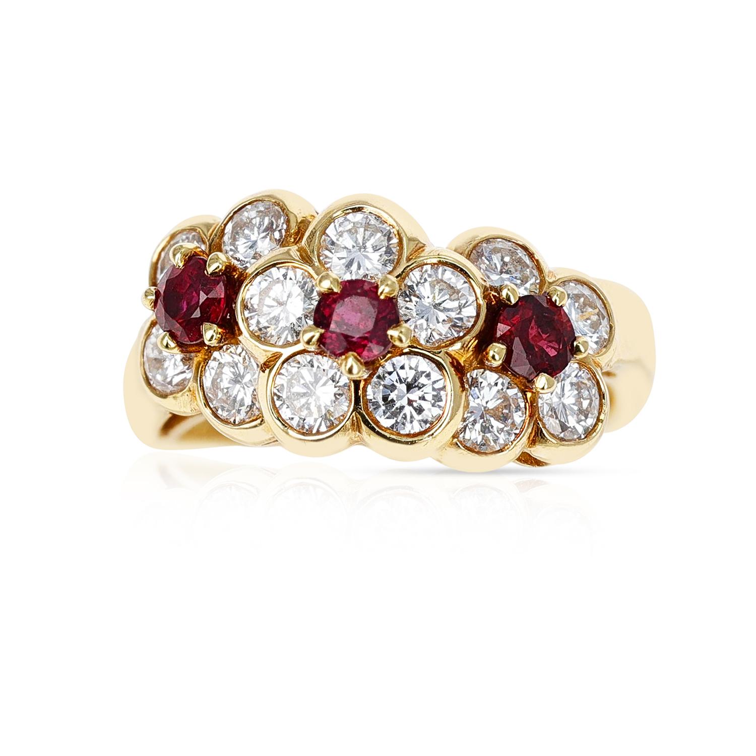 A Van Cleef & Arpels Tri-Floral Ruby and Diamond Ring made in 18 Karat Yellow Gold.  The total weight is 4.80 grams. Ring Size US 5. 