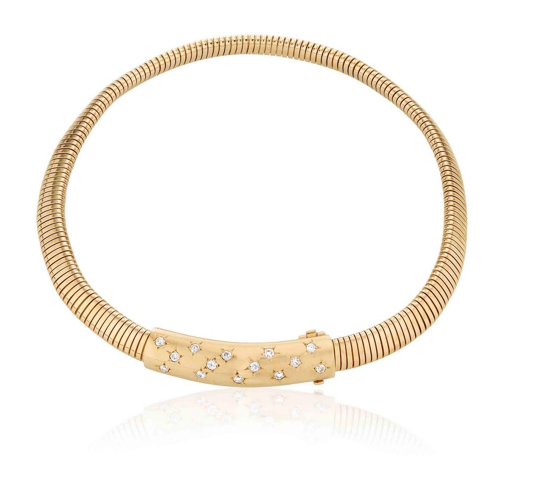 Van Cleef & Arpels Tubogas Passe-Partout Necklace in 18k Yellow Gold. . This piece features a tubogas chain with a hidden clasp that doubles as a pendant, which is also tubular in form. Embellishments of round brilliant diamonds are embedded into