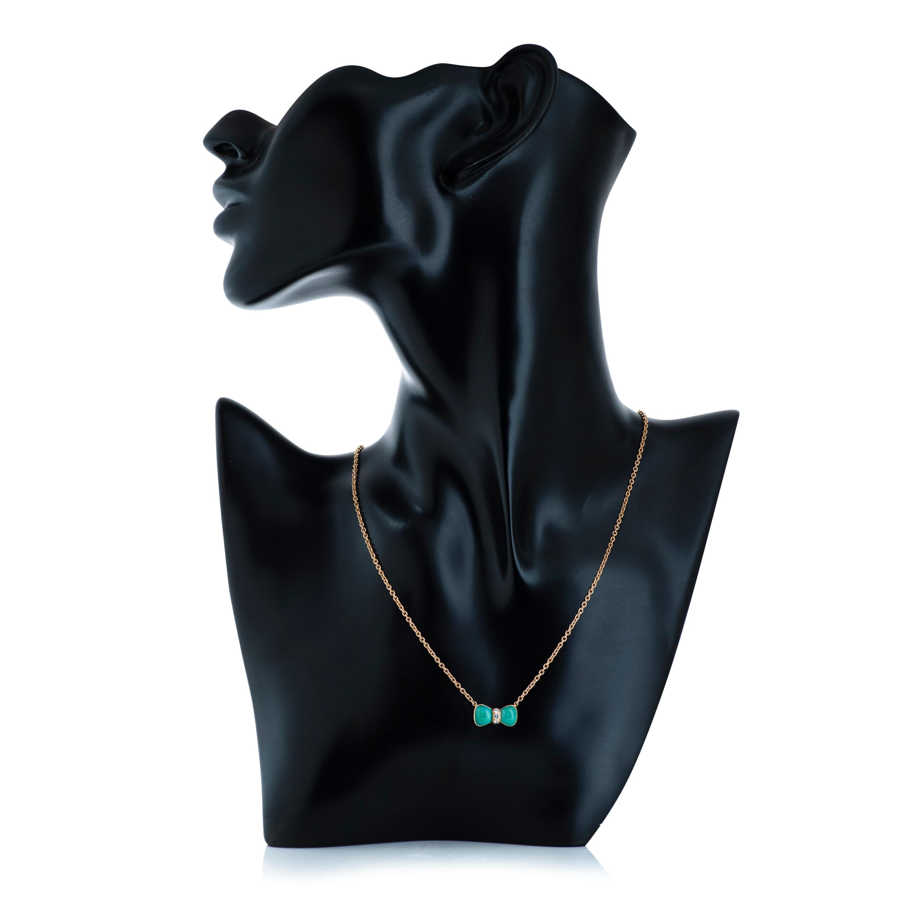 Van Cleef & Arpels turquoise and diamond bow pendant necklace.

This necklace features 2 cabochon turquoise accented by 3 round brilliant cut diamonds totaling approximately 0.12 carats with F-G color and VS clarity.

The necklace is 16