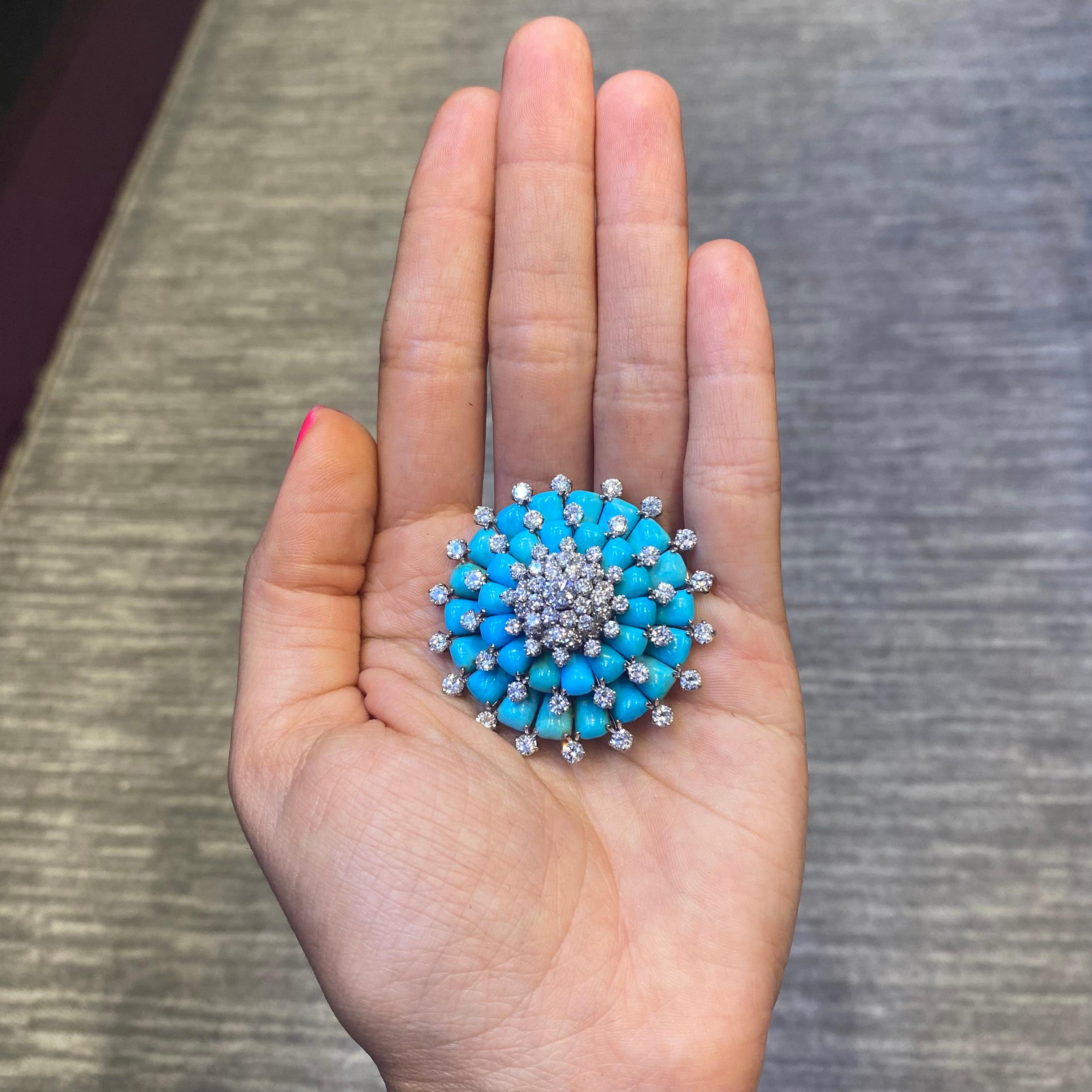 Van Cleef & Arpels Turquoise & Diamond Brooch 
Cabochon turquoise & 72 small round cut diamonds forming a flower surrounding a larger round cut center diamond.

Measurements: 1.5