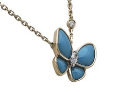 Collier à pendentif « Two Butterfly » de Van Cleef & Arpels, en or jaune 18 carats et turquoise