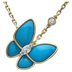 Collier à pendentif « Two Butterfly » de Van Cleef & Arpels, en or jaune 18 carats et turquoise