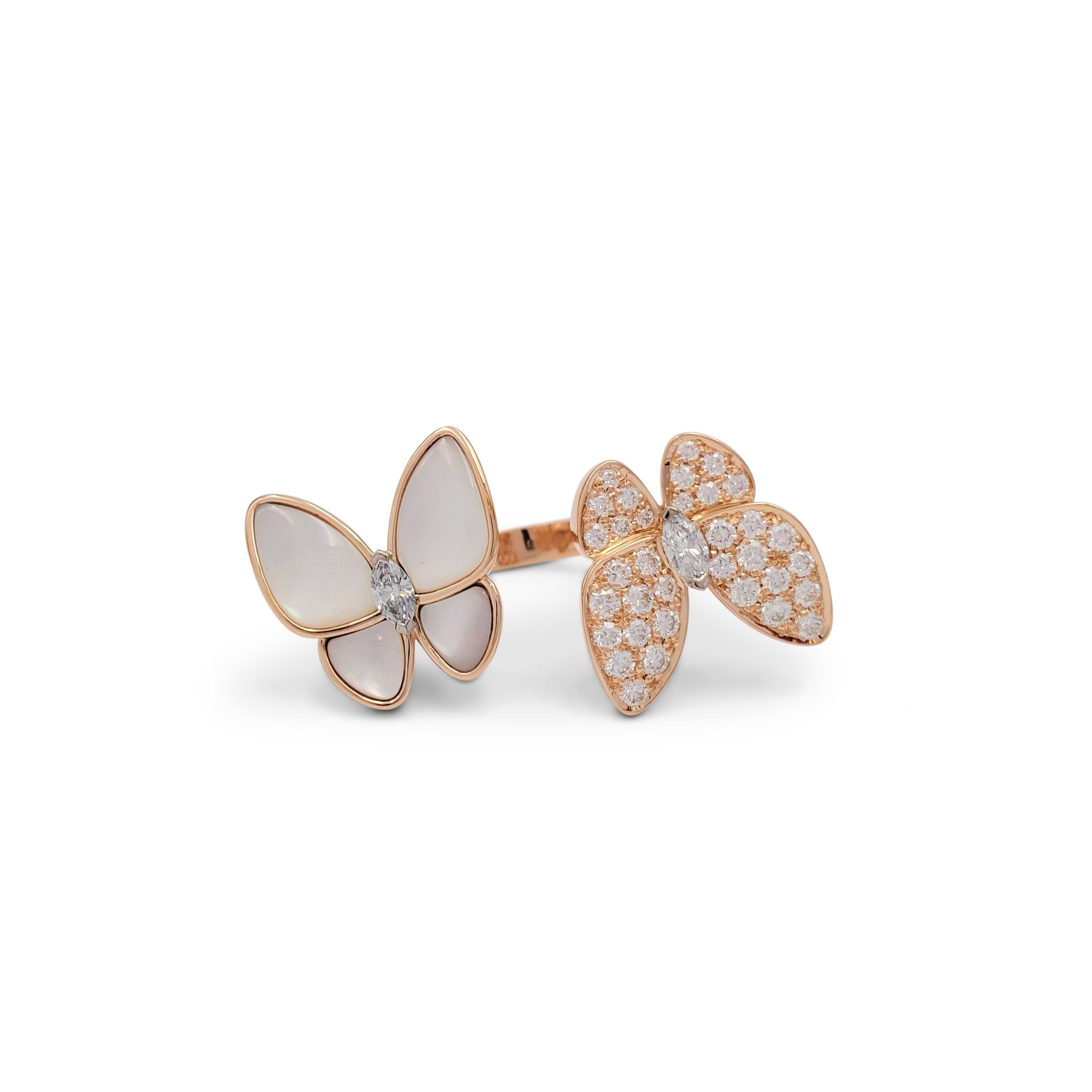 Authentic Van Cleef & Arpels 'Two Butterfly' between-the-finger ring crafted 18 karat rose gold features two butterflies that combine color and asymmetry in a dazzling way. The ring is set with an estimated 1.00 carats of high-quality round