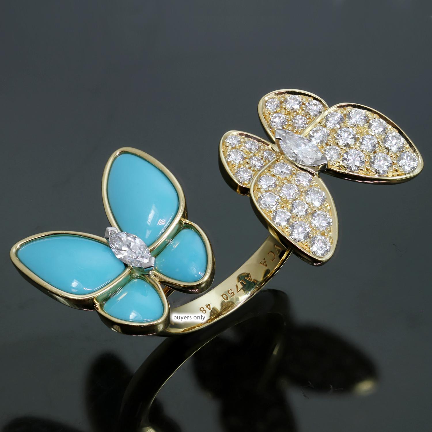 This dazzling Between the Finger ring from Van Cleef & Arpel's Two Butterfly collection is made in 18k  yellow gold and features a pair of butterflies fitting perfectly between two fingers in a striking contrast of 36 D-E-F VVS1-VVS brilliant-cut
