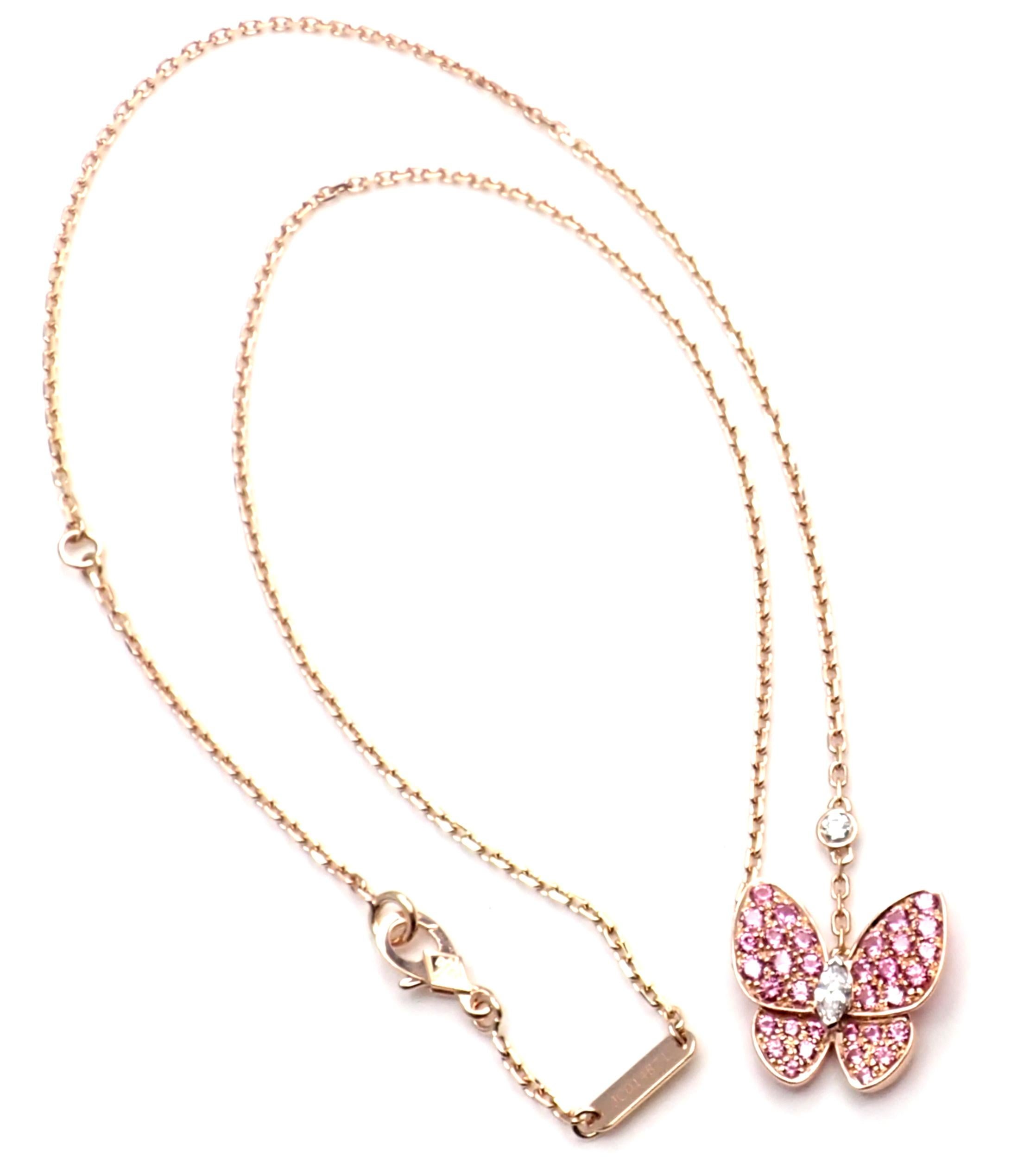 18k Rose Gold Diamond Pink Sapphire Two Butterfly Pendant Necklace by Van Cleef & Arpels. 
With 2 Brilliant Cut Diamonds VVS1 clarity, E color
34 pink sapphires total weight approx.  0.88 carats
This necklace comes with VCA service paper from VCA