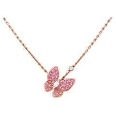 Van Cleef & Arpel’s Two Butterfly pink Sapphire and Diamond pendant.