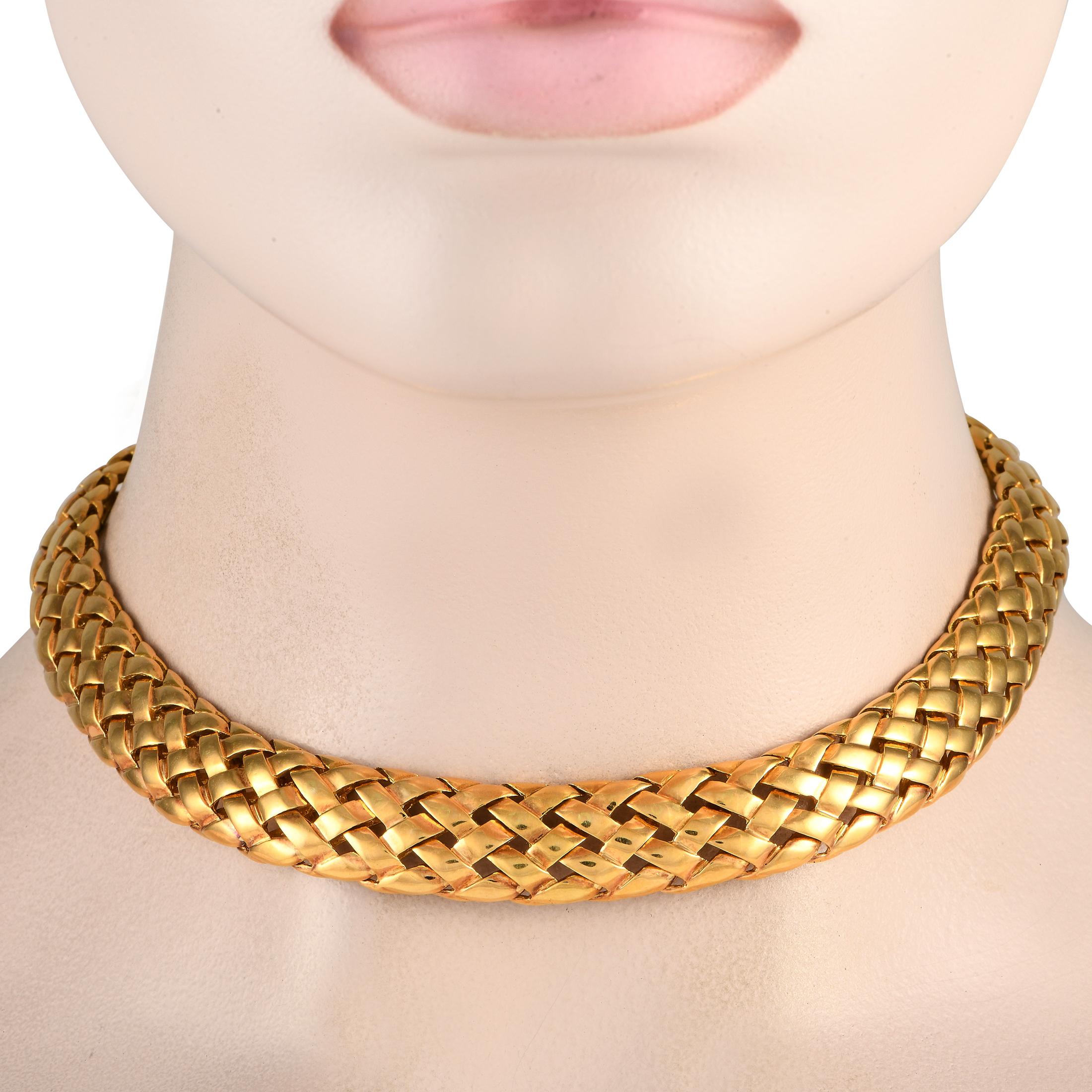 This necklace has the distinct charm of yesteryears. The Van Cleef & Arpels Basket Weave Necklace features an intricate woven pattern in solid 18K yellow gold. Wear this piece to polish your formal wear with retro elegance. The necklace measures