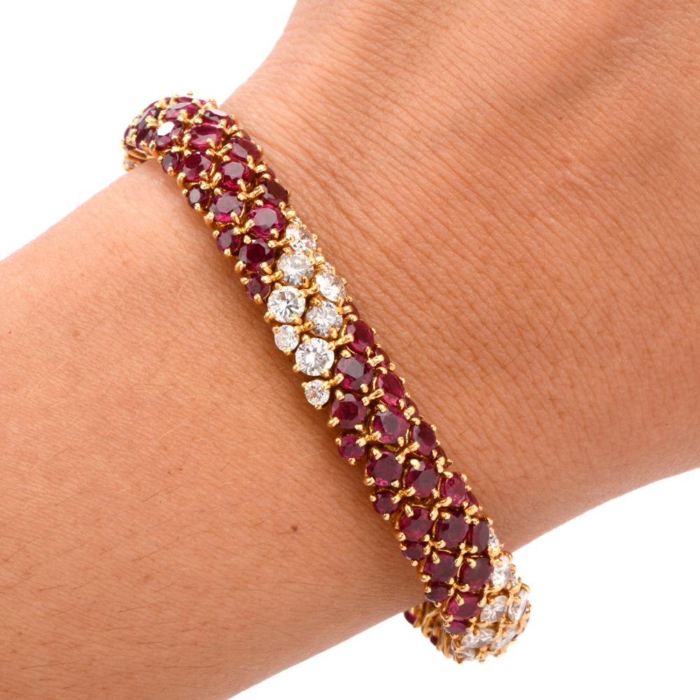 This stunning vinatge French VCA Van Cleef & Arpels ruby and diamond line bracelet is crafted in 18-karat yellow gold, weighing 46.3 grams and measuring 6 ¼” x 10mm wide. Expertly prong-set with 96 round-rubies of rich red color, weighing