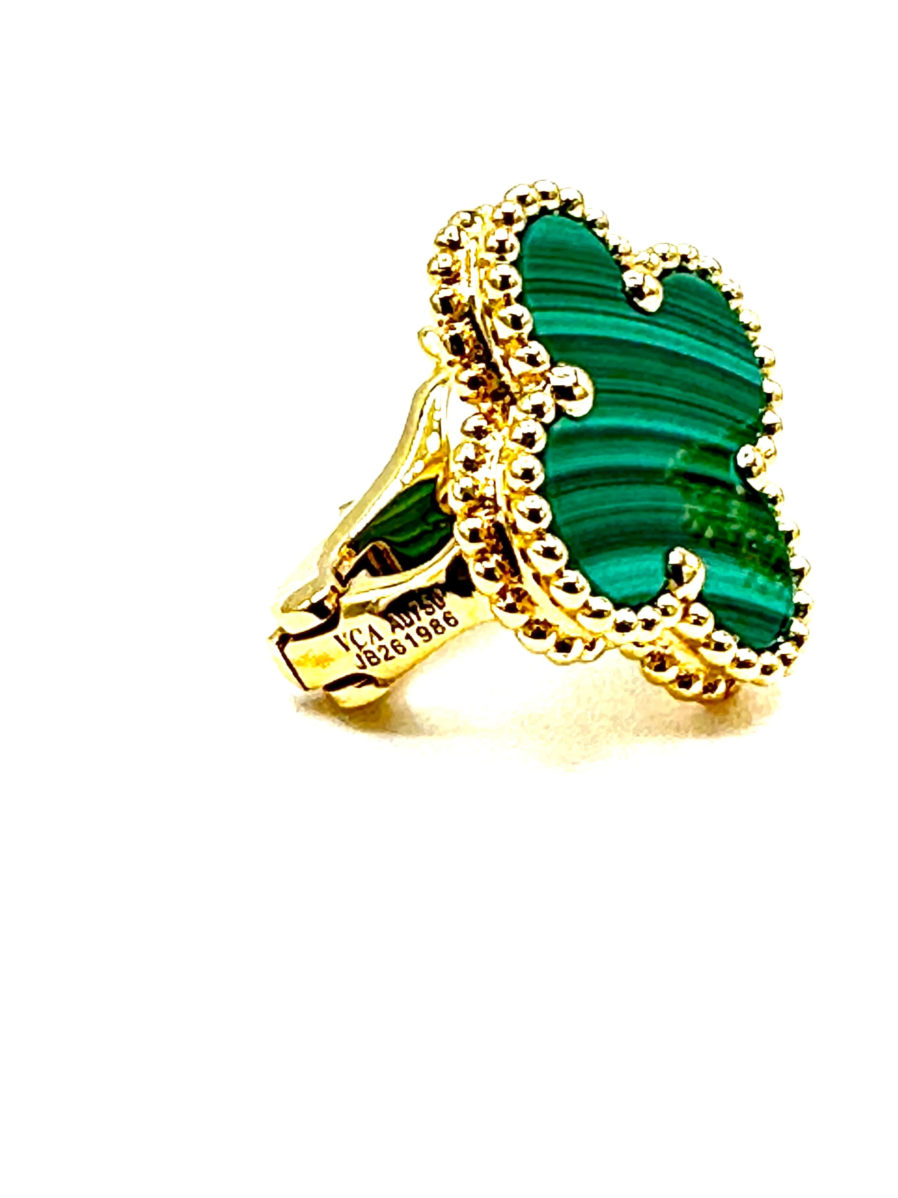The iconic Van Cleef & Arpels Vintage Alhambra Malachite earrings!  The earrings display a vibrant banded Malachite stone, surrounded in the VCA beaded frame, with an omega clip and post in the back, all in 18K yellow gold.  The earrings are signed