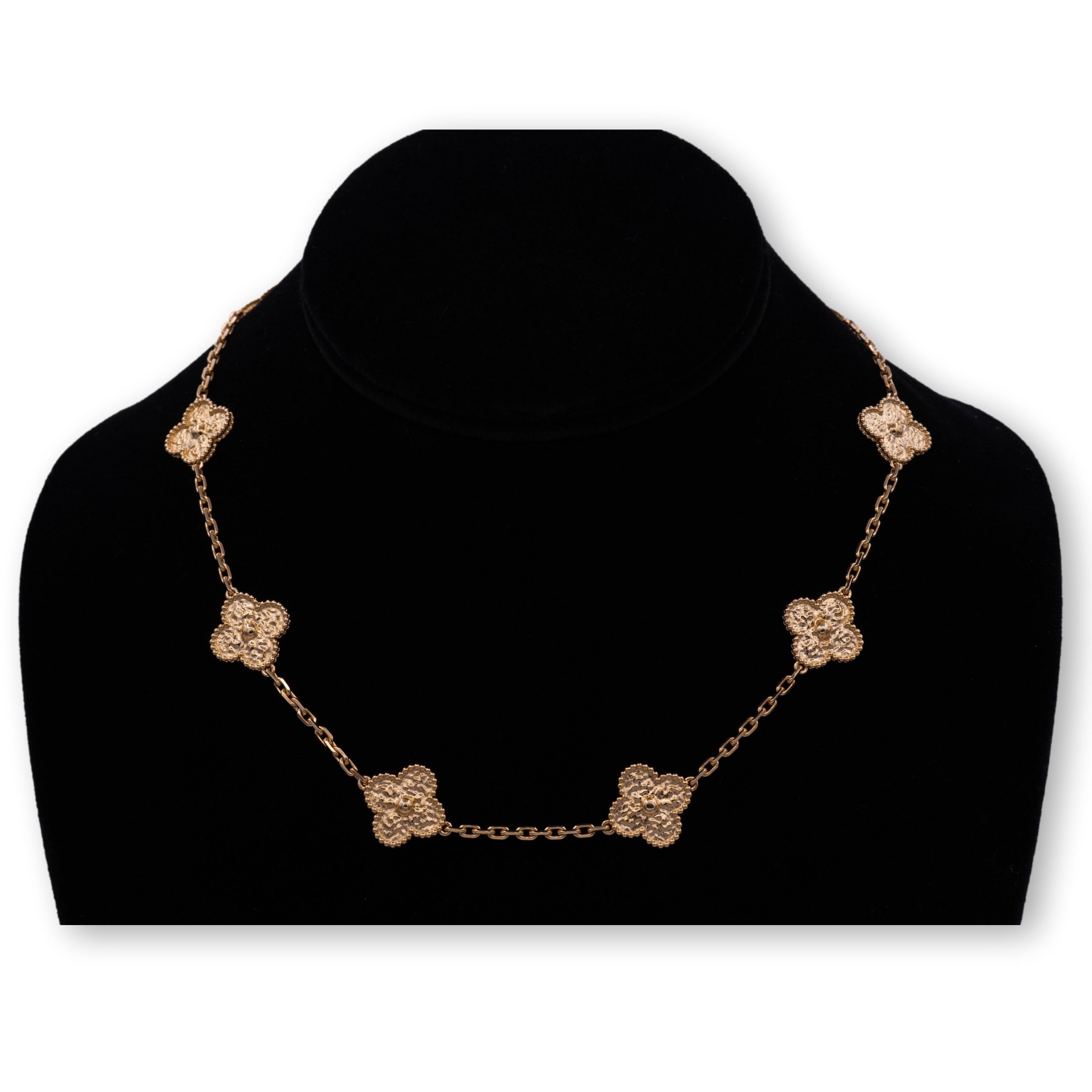 Van Cleef & Arpels necklace from the Vintage Alhambra collection finely crafted in 18 Karat Rose Gold featuring 10 signature clover motifs with a hammered gold finish on a link chain with large lobster claw closure. Each ornament measures 0.59” Wide