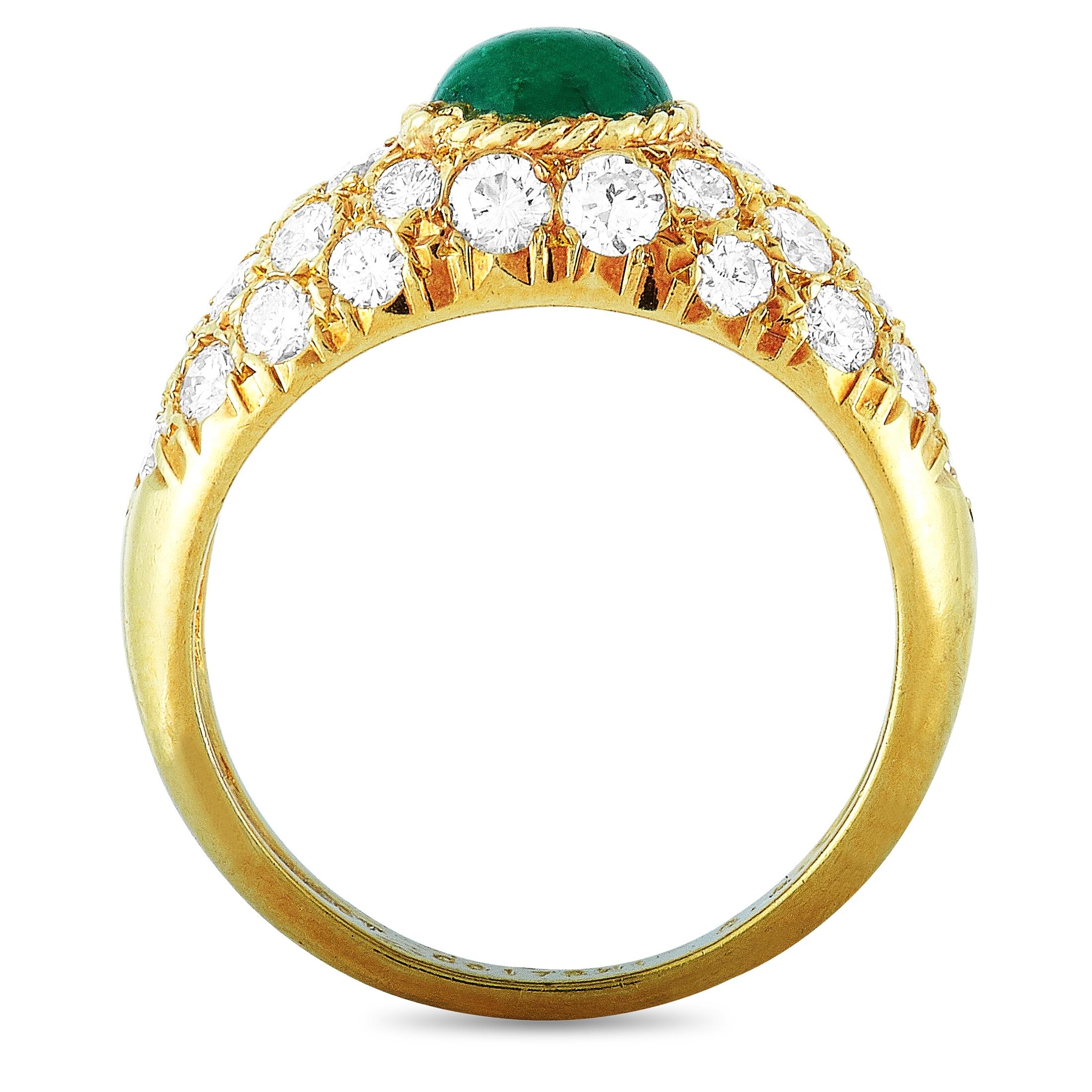 This vintage Van Cleef & Arpels ring is crafted from 18K yellow gold and weighs 4.2 grams, boasting band thickness of 2 mm and top height of 6 mm, while top dimensions measure 20 by 6 mm. The ring is set with an emerald and a total of 0.86 carats of