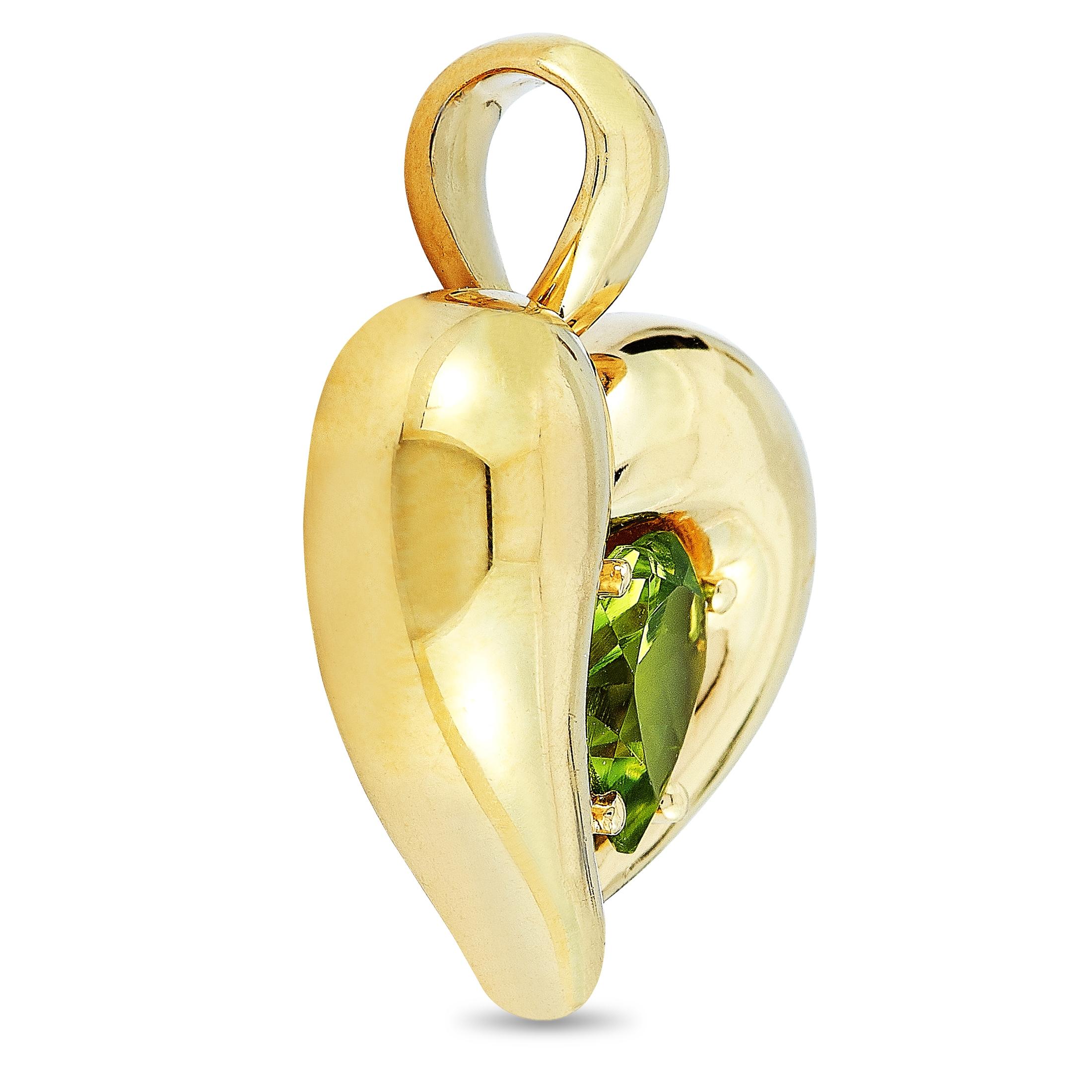 This vintage Van Cleef & Arpels heart pendant is made of 18K yellow gold and embellished with a peridot. The pendant weighs 10.2 grams and measures 0.90” in length and 0.87” in width.

Offered in estate condition, this item includes the
