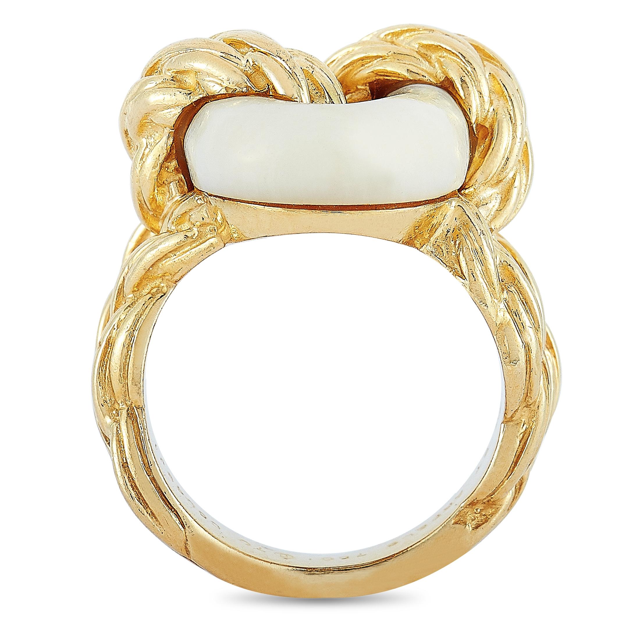 This vintage Van Cleef & Arpels ring is made out of 18K yellow gold and coral and weighs 14.5 grams. The ring boasts band thickness of 4 mm and top height of 8 mm, while top dimensions measure 18 by 20 mm.
Ring Size: 5