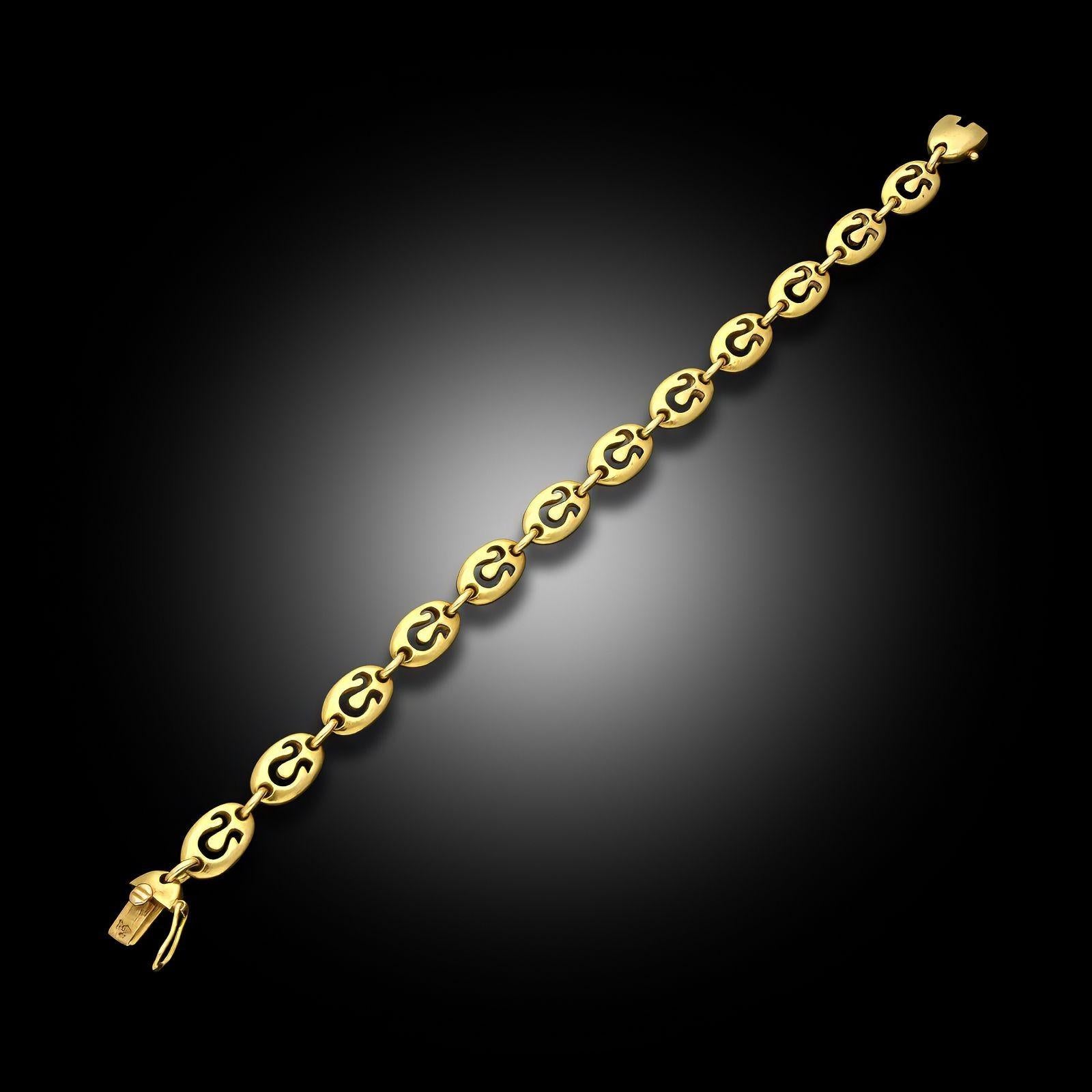A vintage 18ct yellow gold zodiac bracelet by Van Cleef & Arpels, circa 1970. The articulated bracelet is designed as a series of uniform oval links each featuring a cut out stylised zodiac symbol for Leo. Secured by a tongue and box clasp and