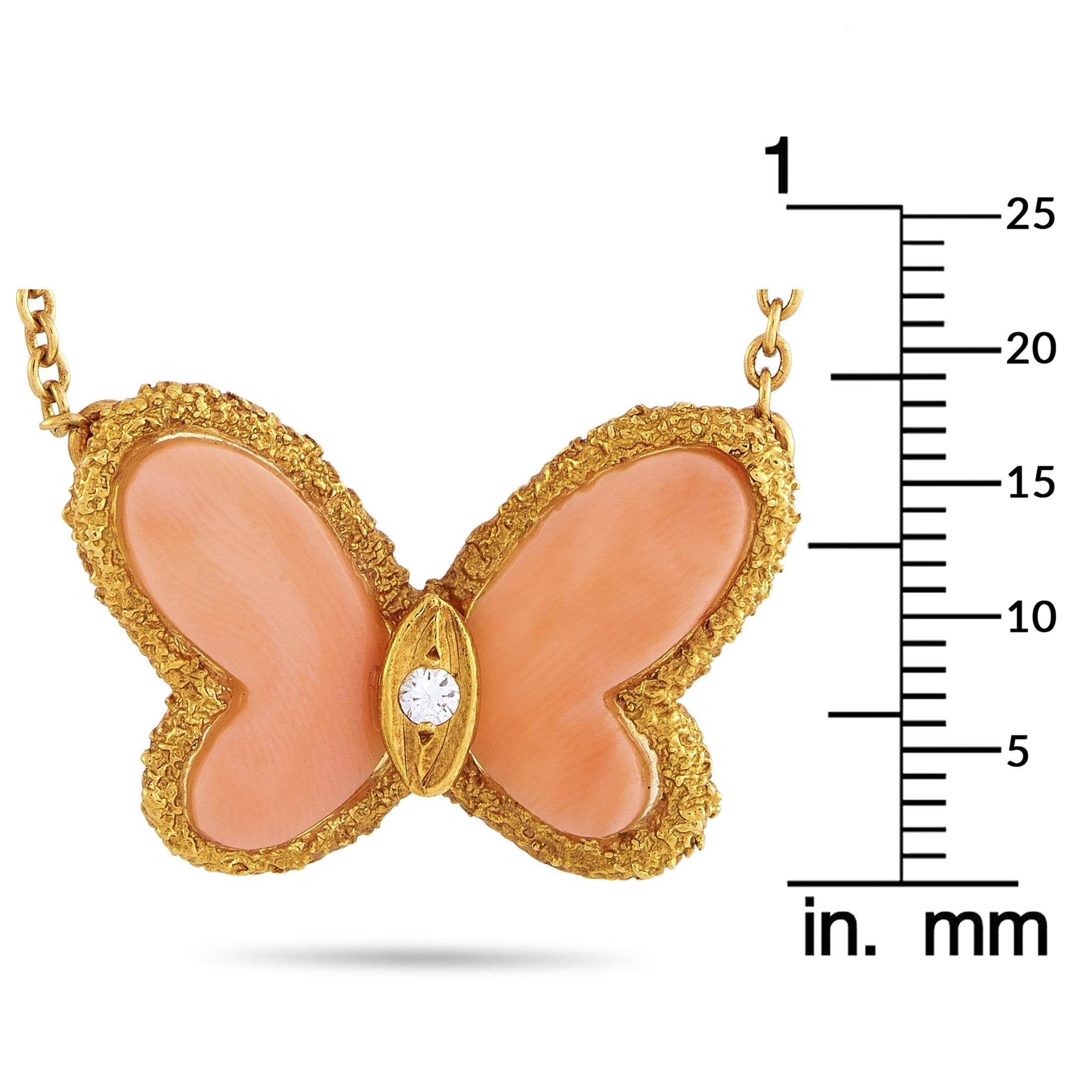 This vintage Van Cleef & Arpels necklace is made of 18K yellow gold and embellished with pink coral and a diamond stone. The necklace weighs 6.2 grams and is presented with a 16” chain and a butterfly pendant that measures 0.75” in length and 1” in