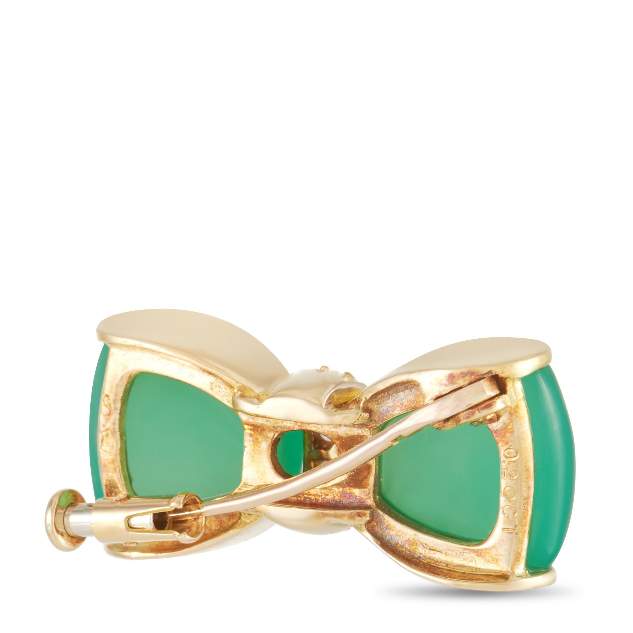 Bold colors and shimmering gemstones make this vintage bow tie brooch from Van Cleef & Arpels an elegant addition to any jewelry collection. Bright green chrysoprase gives this brooch a captivating color, while shimmering round-cut diamonds in the