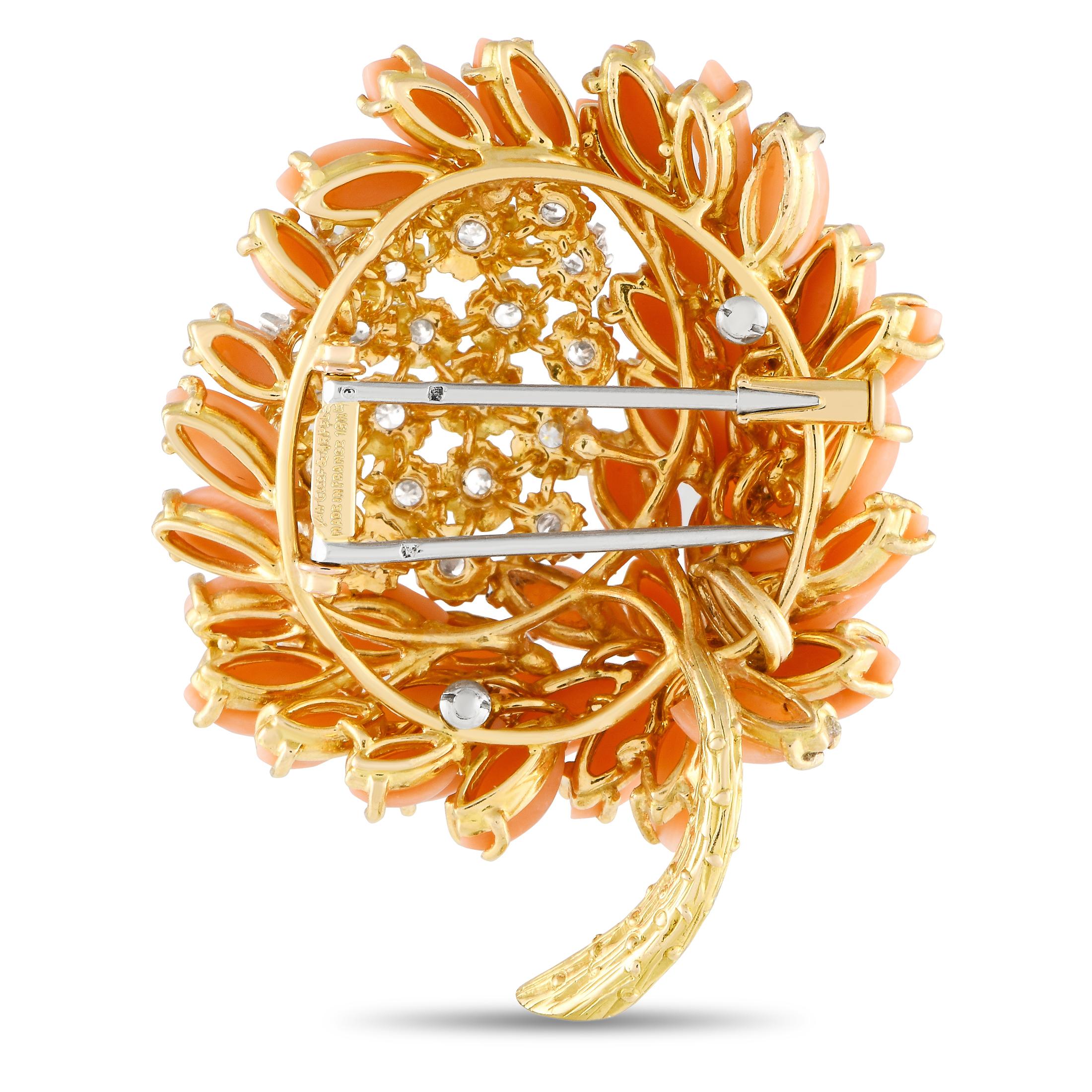 Add color to an outfit while still looking chic with this vintage Van Cleef & Arpels flower brooch. It is expertly crafted in solid 18K yellow gold and decorated with a central cluster of round diamonds totaling 1.15 carats. Football-shaped coral