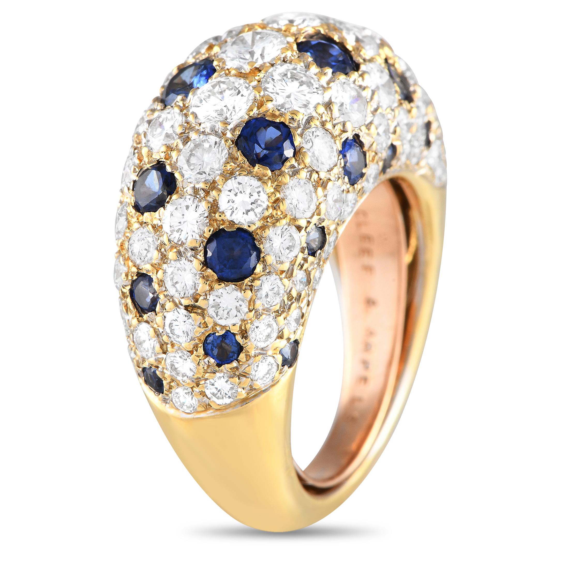 This vintage Van Cleef & Arpels ring is covered in an array of gemstones that will continually catch the light. Diamonds with a total weight of 3.75 carats contrast with radiant blue sapphires on this exquisite piece, which features an opulent 18K