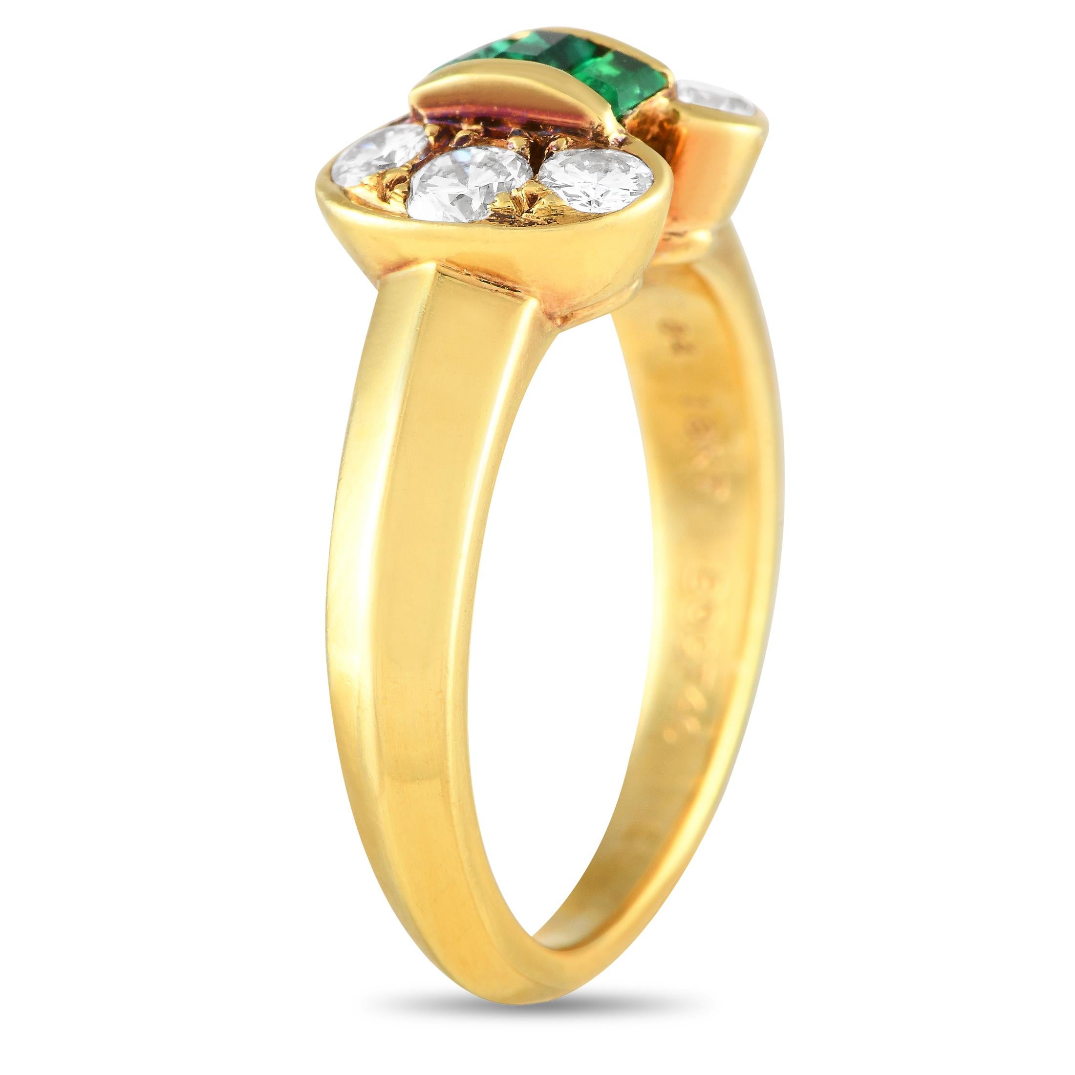 This vintage Van Cleef & Arpels ring will always make a subtle statement. The emerald center stones are elevated by sparkling diamond accents in a charming bow shaped design. The sleek 18K yellow gold setting features a 2mm wide band and a 5mm top