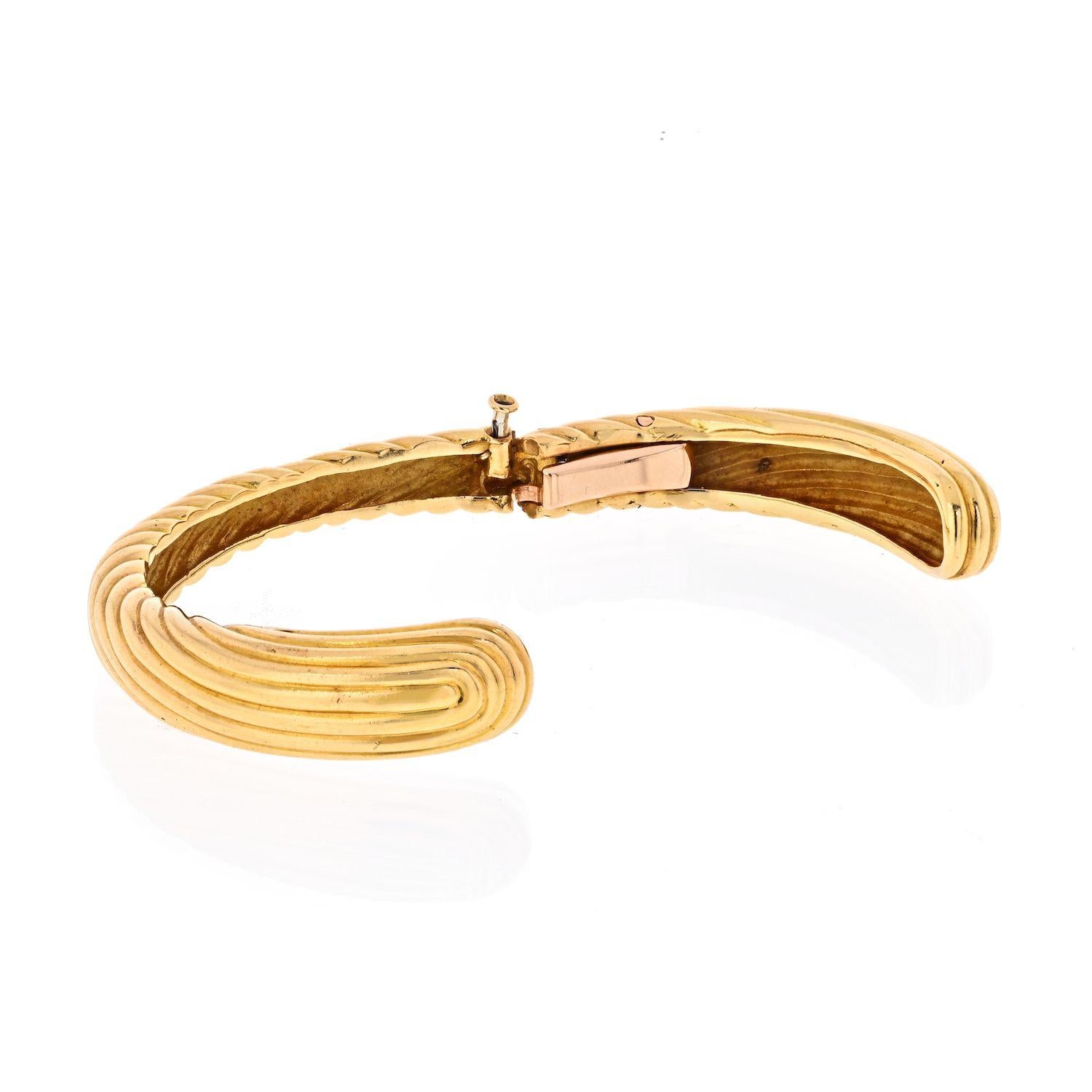 Made by Van Cleef & Arpels in 18K Yellow Gold this beautiful high polished ribbed finish hinged cuff is a perfect fit for your out and about. 
Wrist size 6 to 6.25 this is  bracelet to stack with your other favorites. 
Gift this lovely bracelet by
