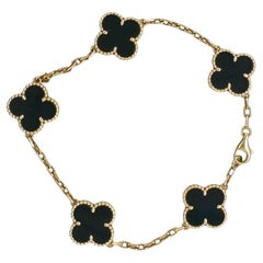 Van Cleef & Arpels Vintage-Armband aus 18 Karat Gold mit 5 Motiven aus Onyx.