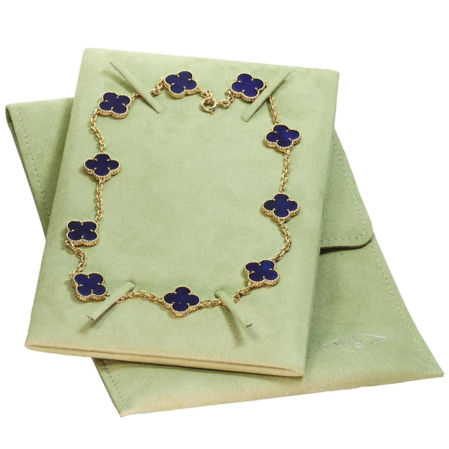 This classic vintage Van Cleef & Arpels necklace is crafted in 18k yellow gold and features 10 lucky clover motifs inlaid with lapis lazuli in round bead settings. Made in France circa 1980s.  Measurements: 0.59