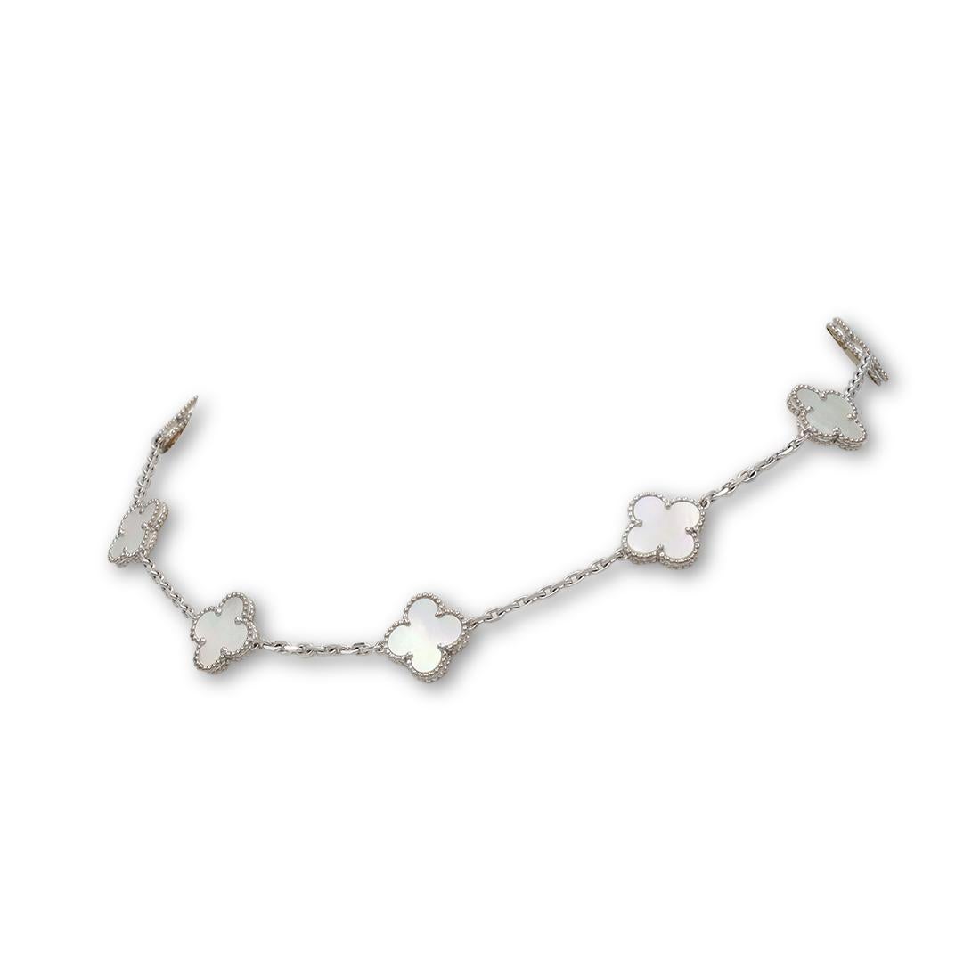 Authentic Van Cleef & Arpels 'Vintage Alhambra' necklace crafted in 18 karat white gold featuring 10 clover leaf inspired motifs of carved mother-of-pearl gemstones. Signed VCA, Au750, with hallmarks and serial number. Necklace is not presented with