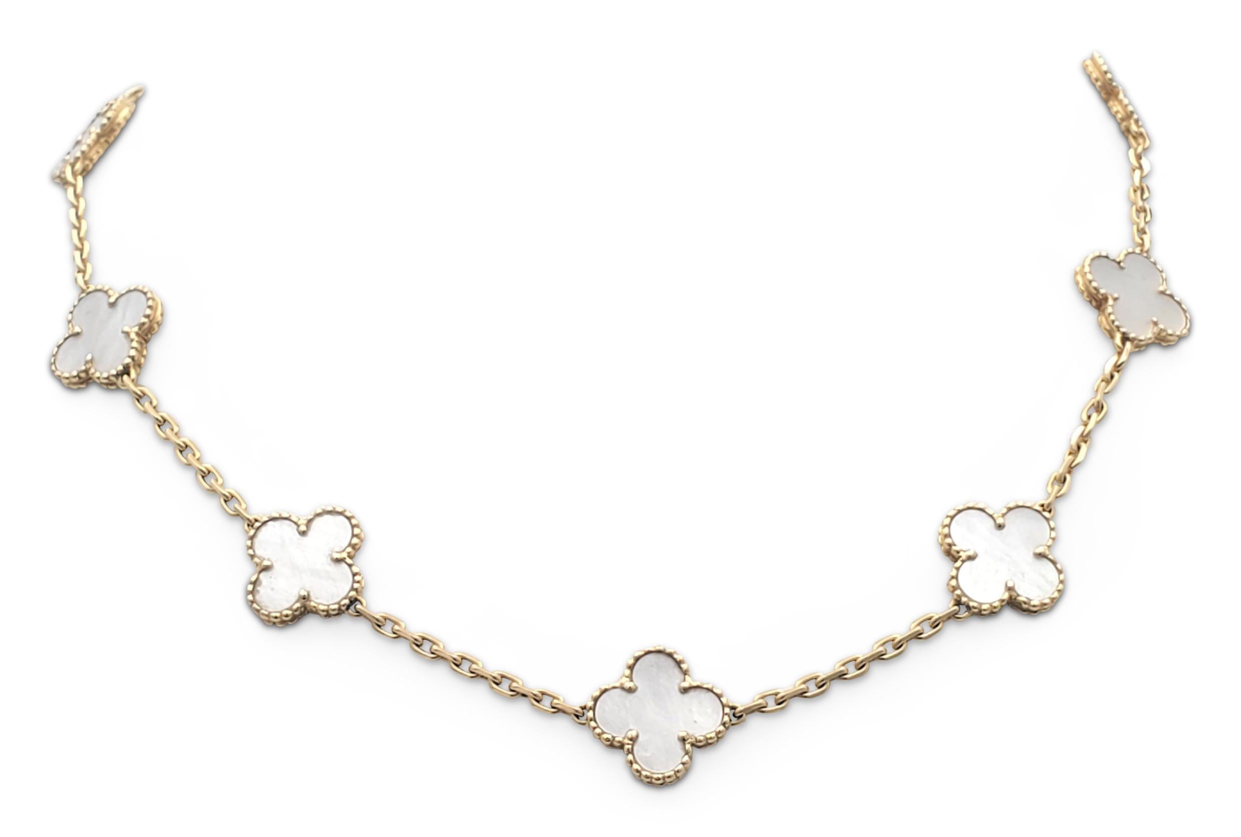 Authentic Van Cleef & Arpels 'Vintage Alhambra' necklace crafted in 18 karat yellow gold featuring 10 clover leaf inspired motifs of mother-of-pearl stones. Signed VCA, Au750, with serial number and hallmarks. The necklace is not presented with